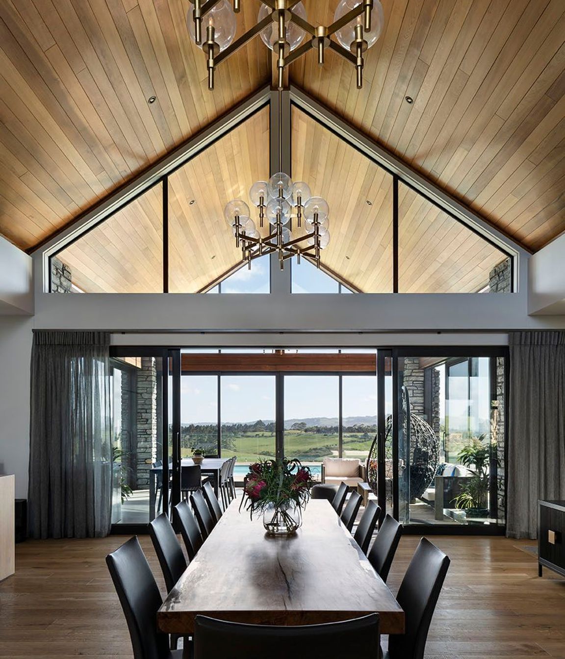 Vaulted cedar ceilings flow through to the conservatory with reflected clerestory windows.
