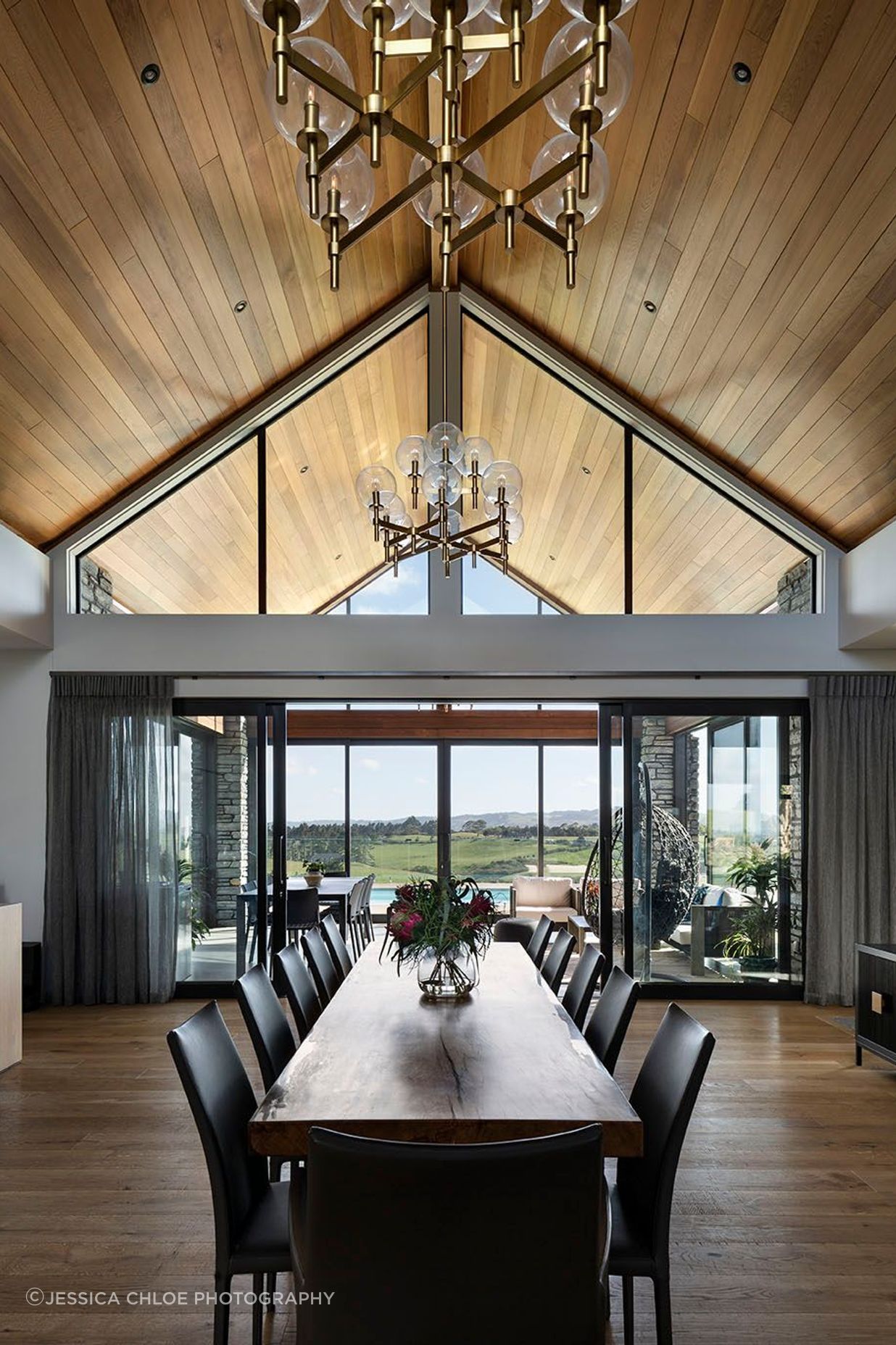 Vaulted cedar ceilings flow through to the conservatory with reflected clerestory windows.