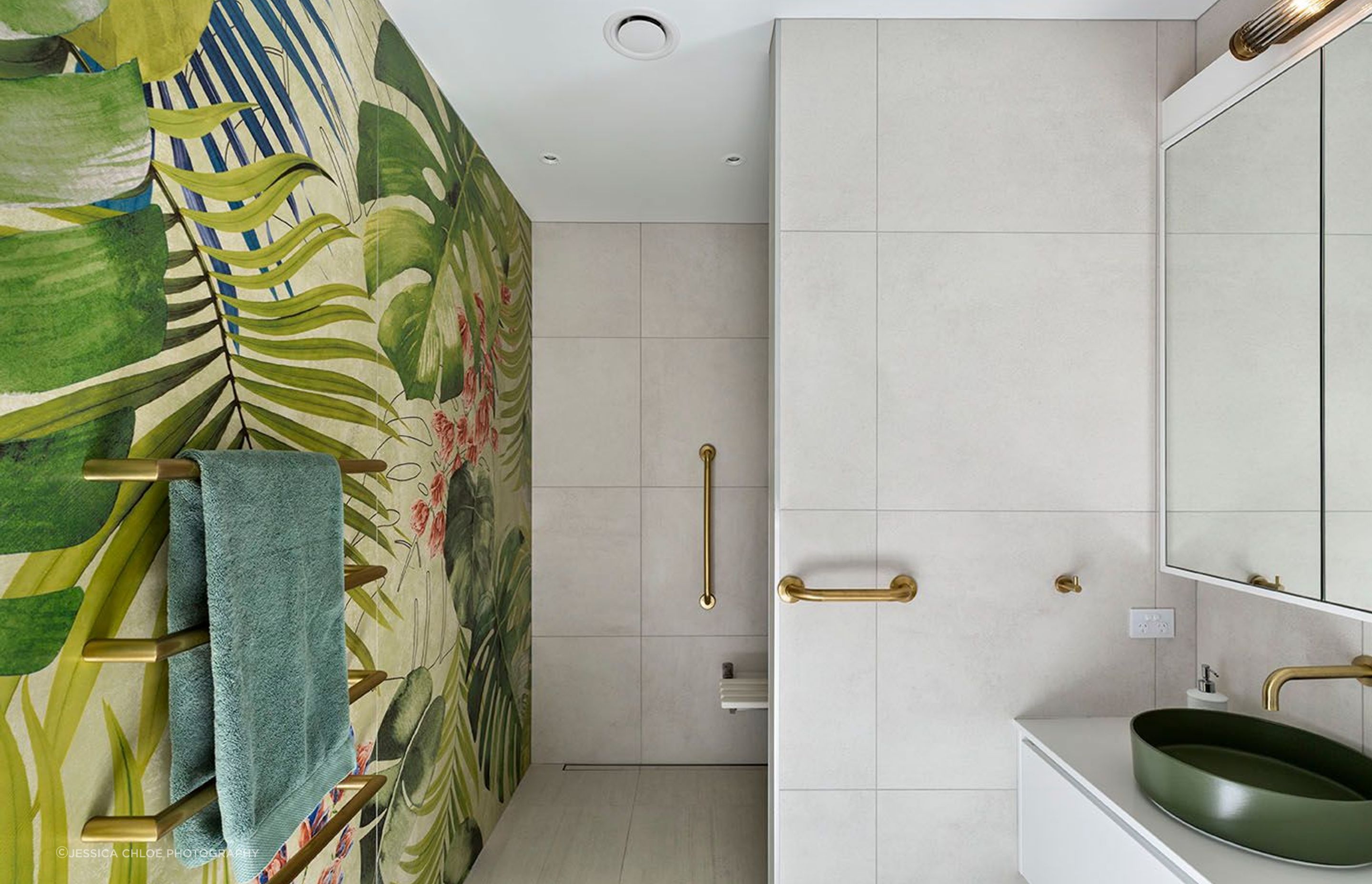 Feature tiles add vibrance to the bathroom.
