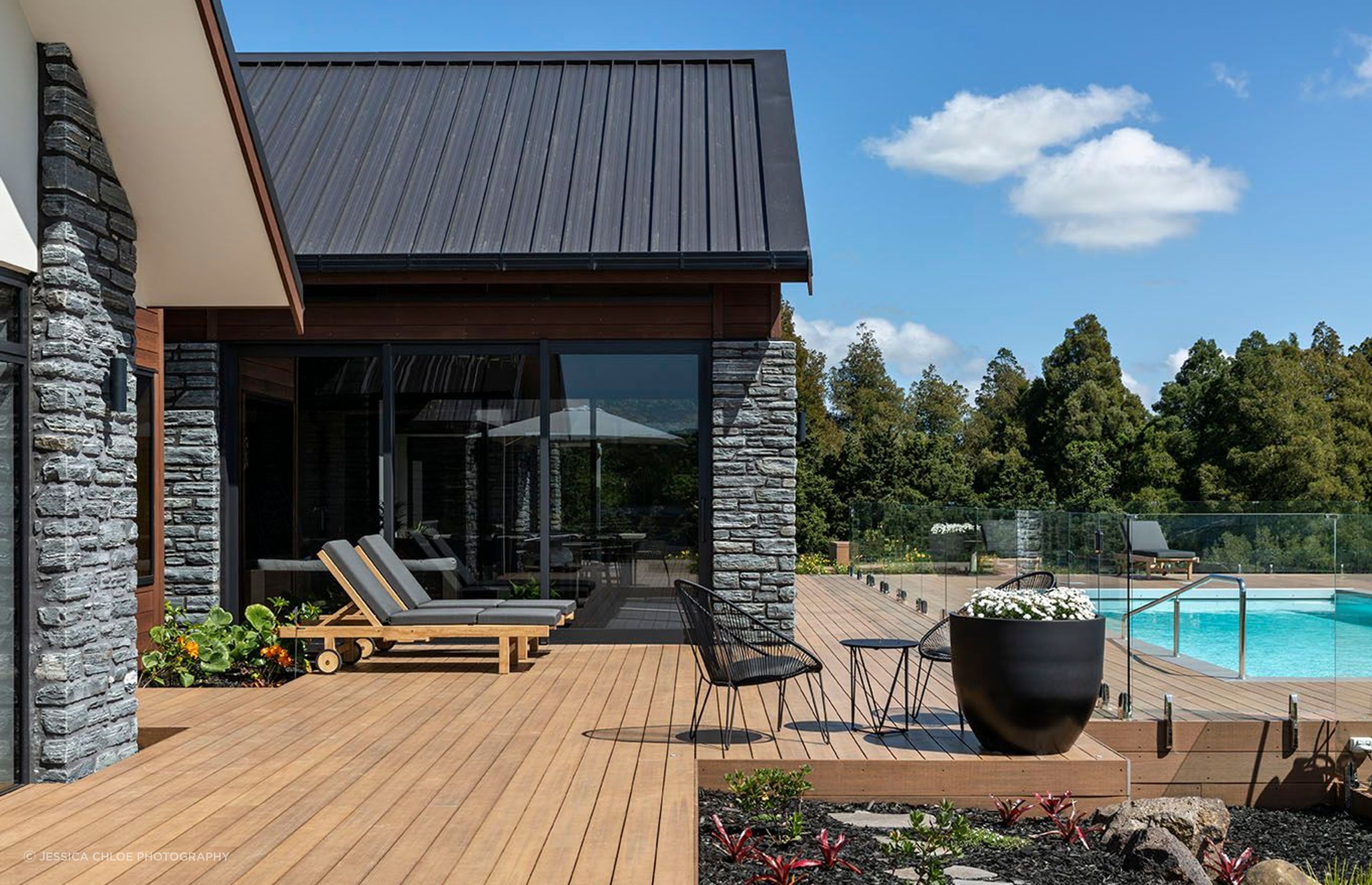 Living areas open out view extensive decks to the pool.