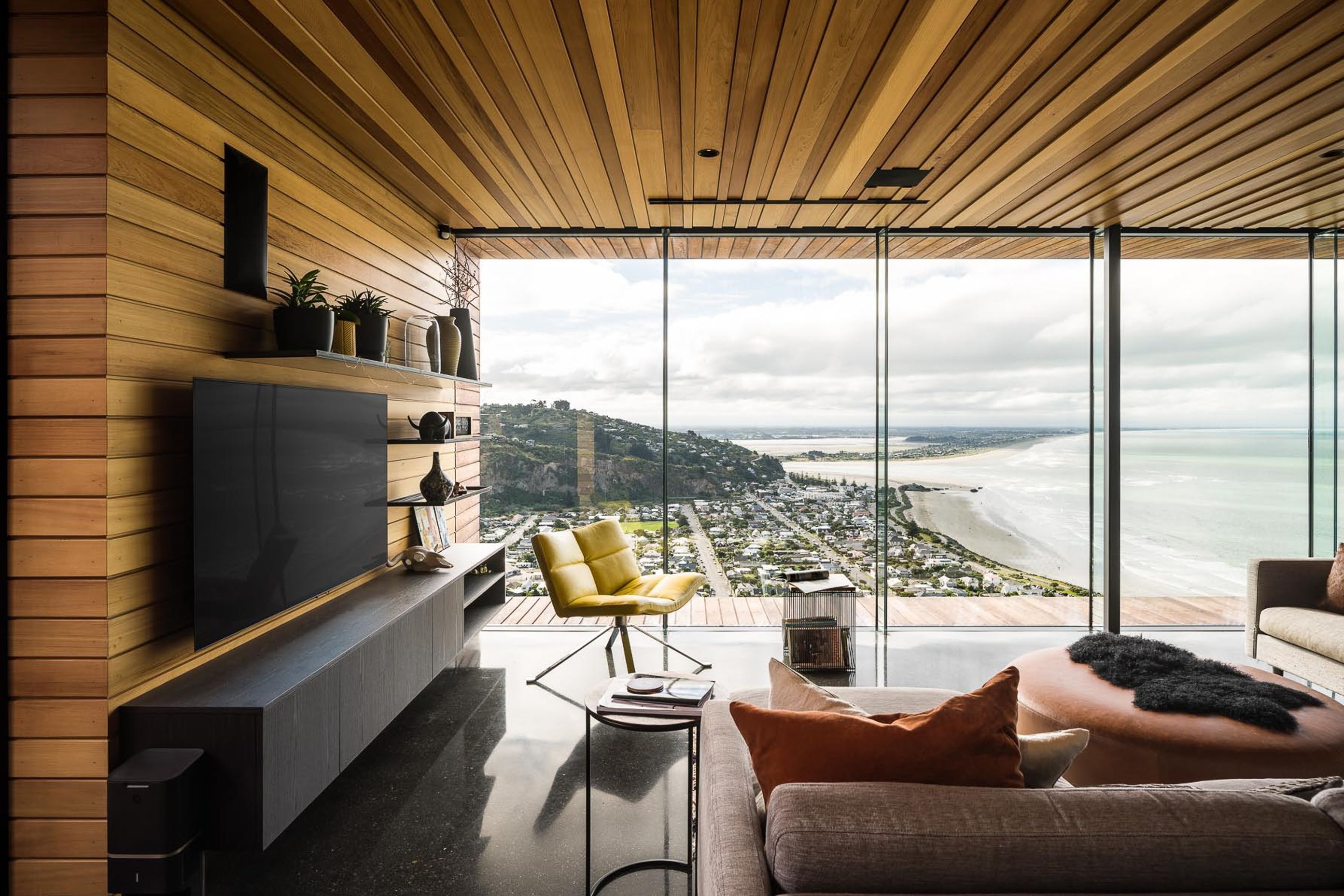 The polished concrete flooring captures the warmth of the afternoon sun.