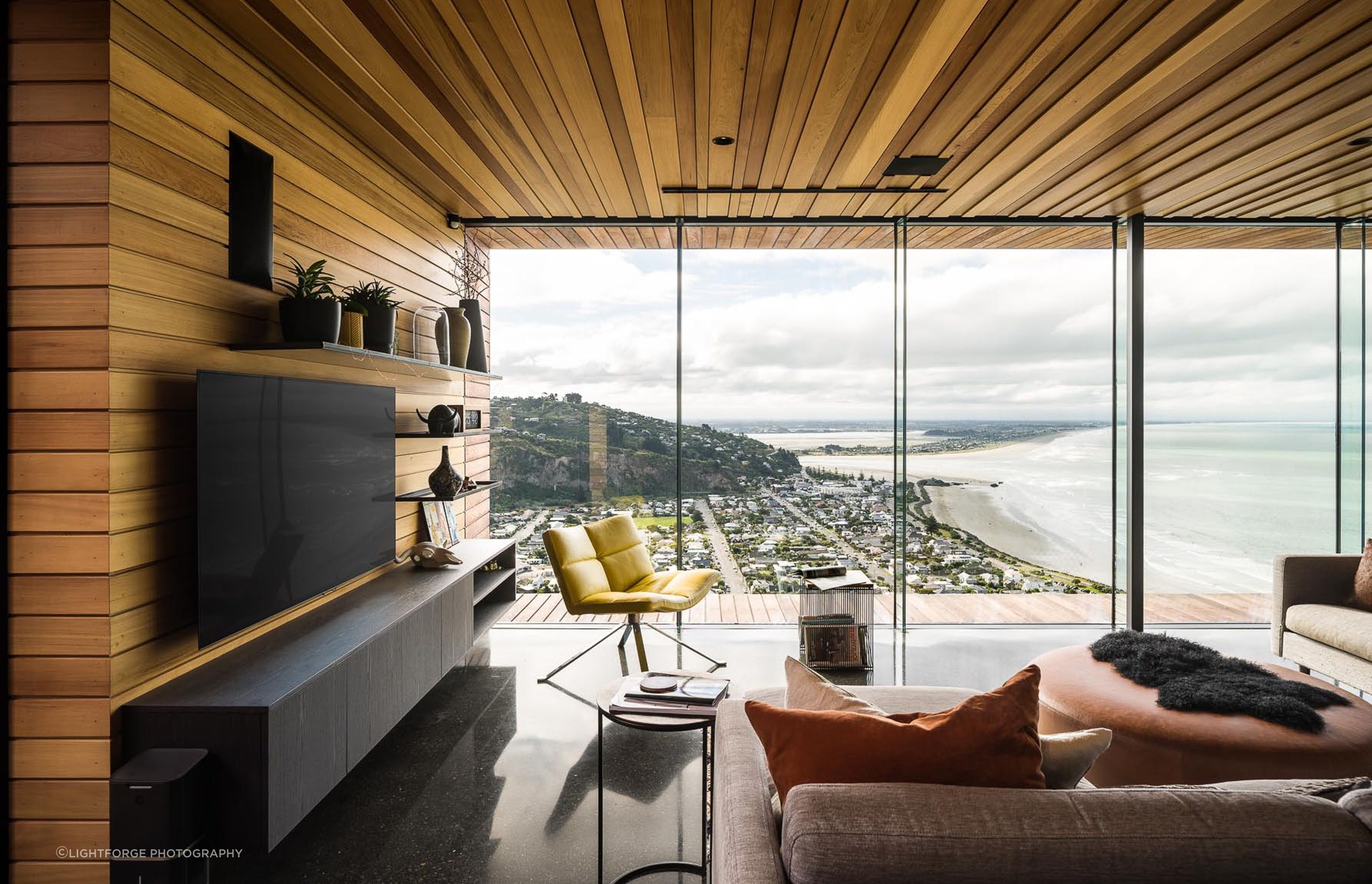 The polished concrete flooring captures the warmth of the afternoon sun.