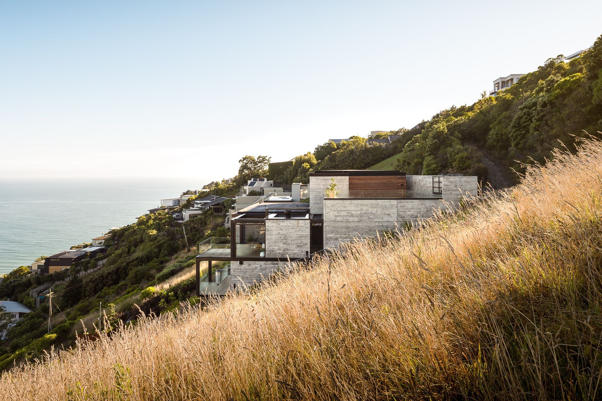 The concrete structure emerges from the landscape in cubed forms.