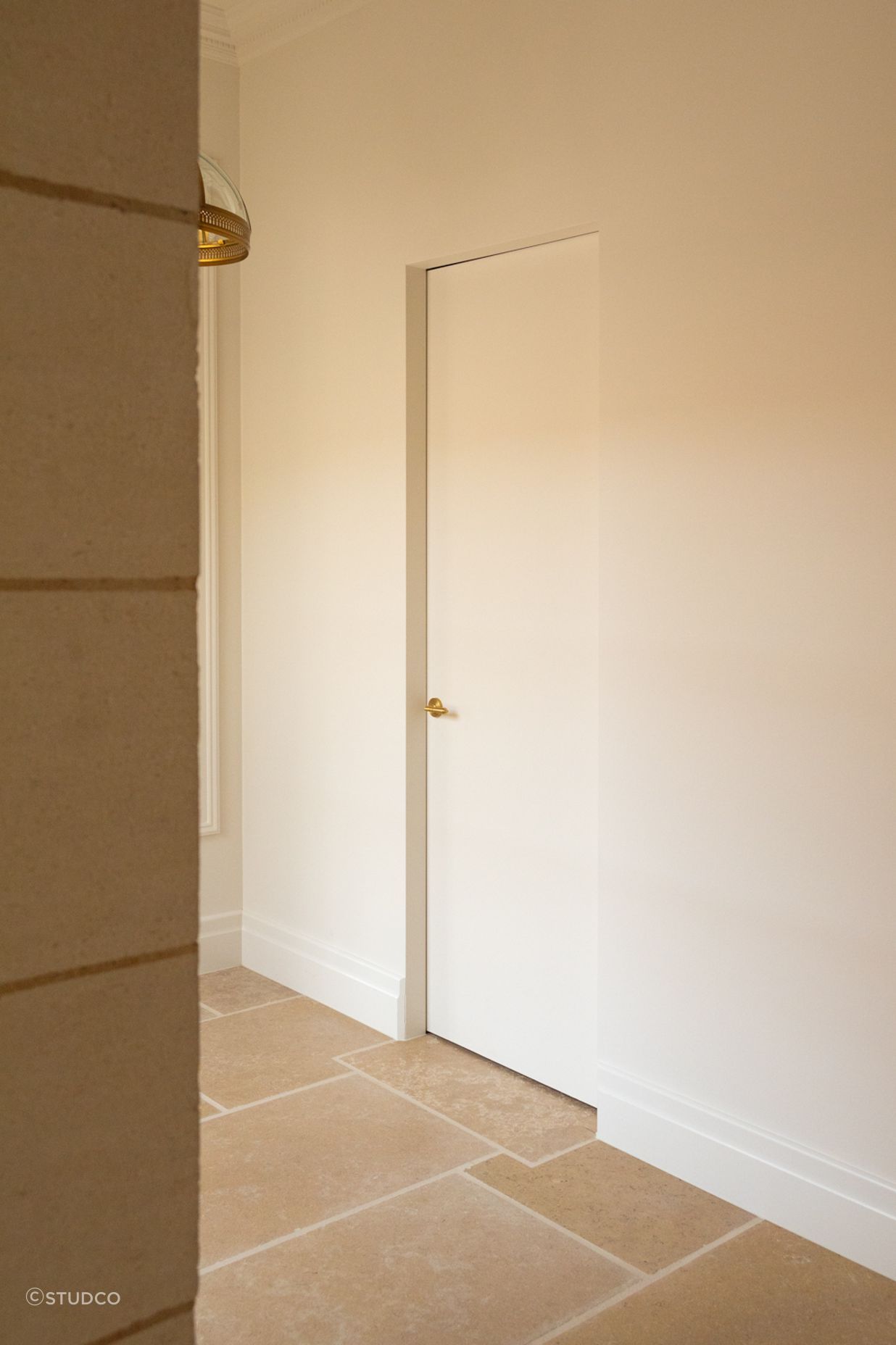The SRC frame brings a clean line perimeter to this hallway opening that comfortably blends into its surroundings.