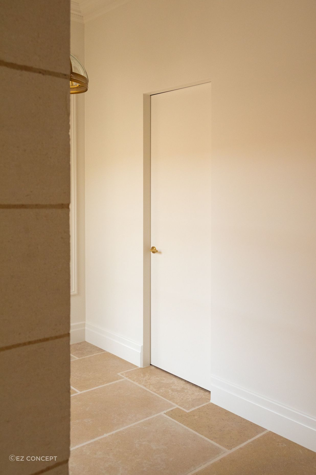 The SRC frame brings a clean line perimeter to this hallway opening that comfortably blends into its surroundings.