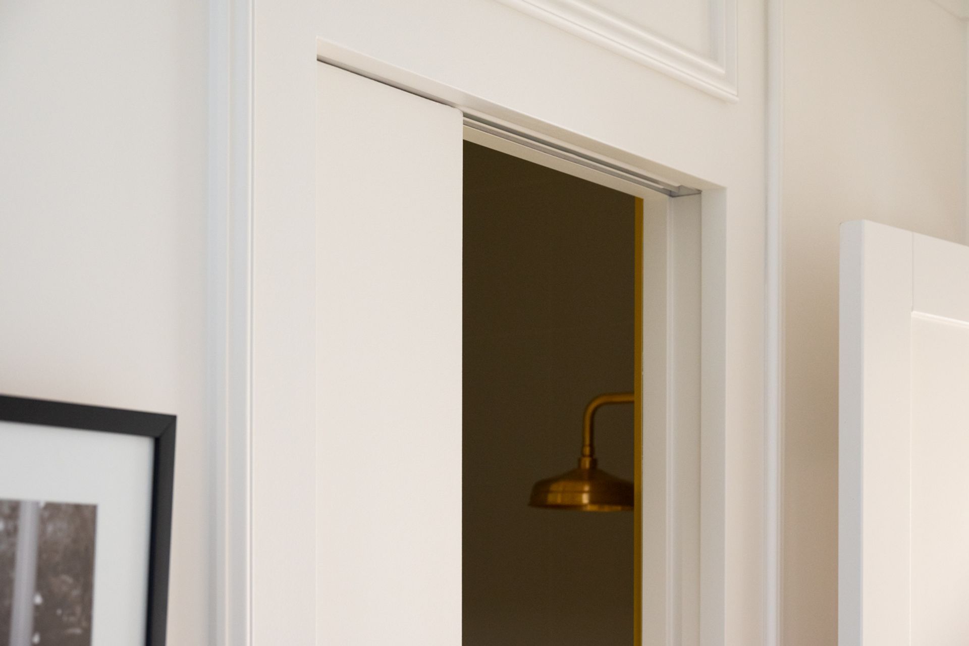 Traditional details and cornices around the bathroom door bring vibrancy whilst the SlideSet opening itself offers a modern counterbalance.