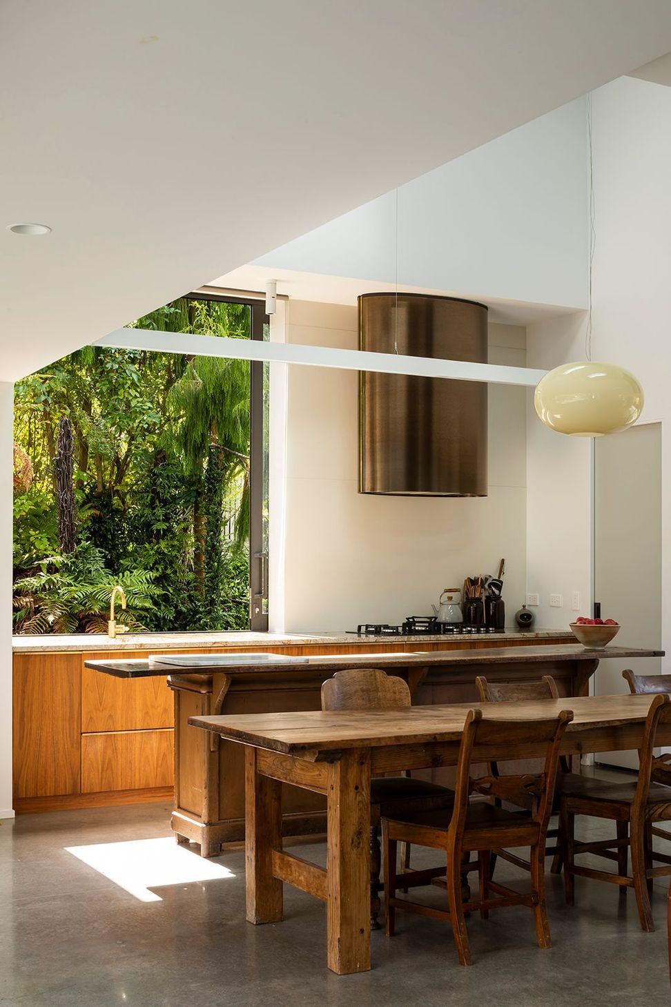 The large sliding kitchen window gives a jaw-dropping picture view to the native bush reserve.