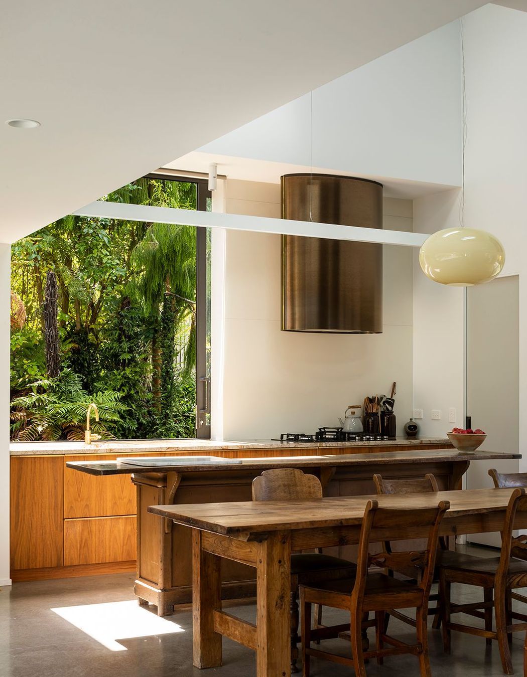 The large sliding kitchen window gives a jaw-dropping picture view to the native bush reserve.