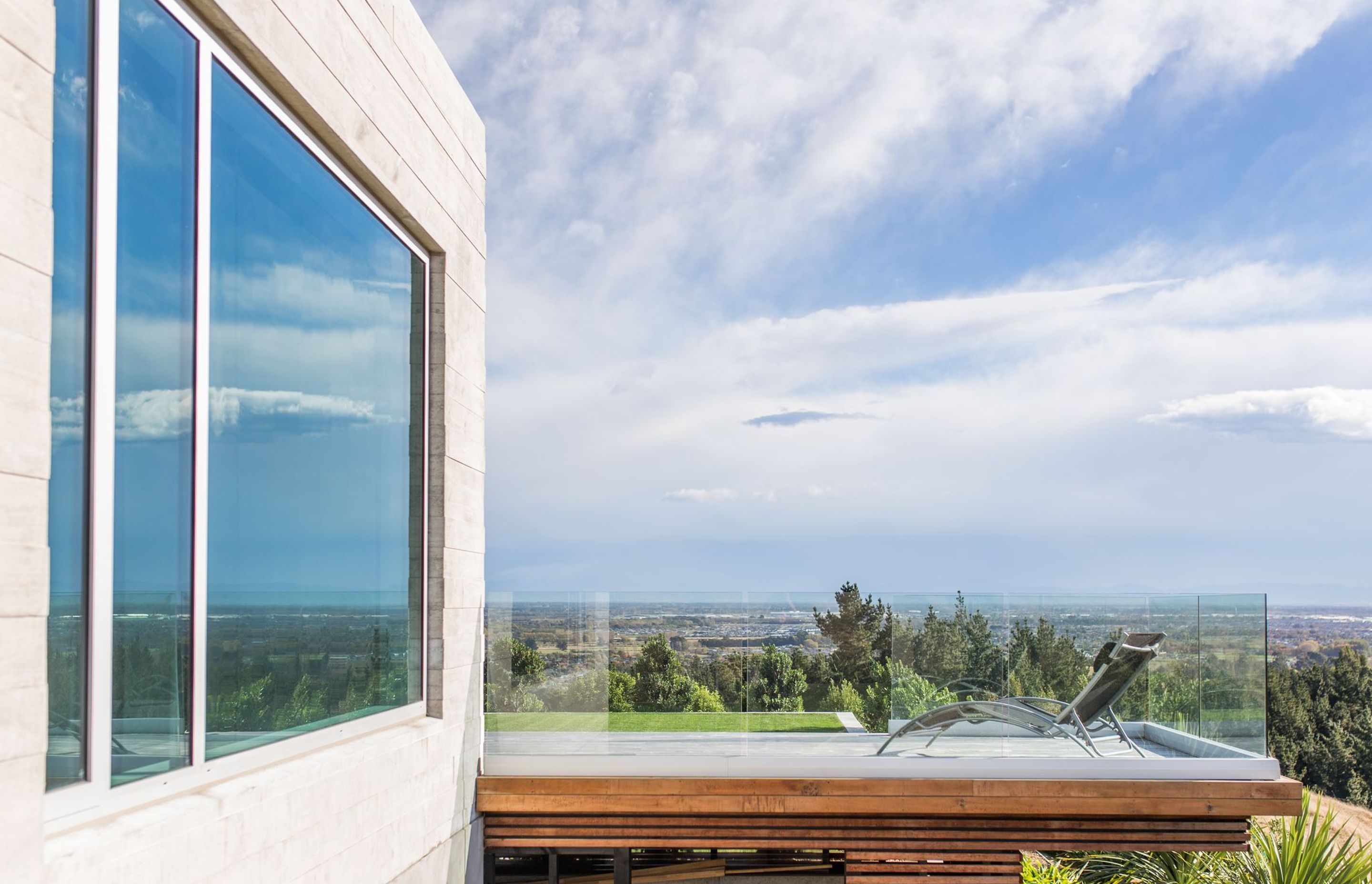 Extending past the building envelope, the deck features a 'cantilevered' element that helps create a sense of the house being at one with the natural environment.