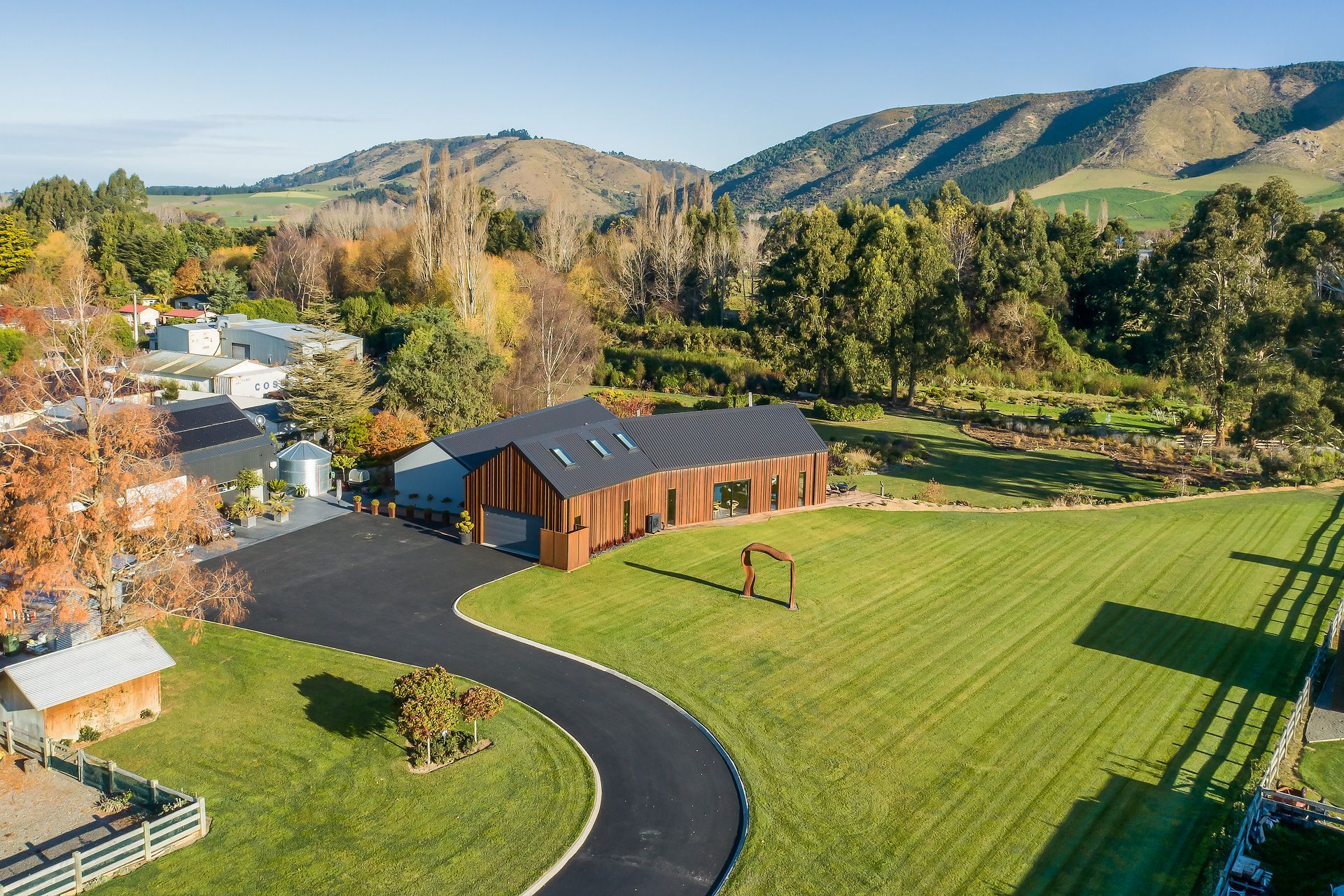 A corten sculpture was crafted to welcome guests at the front of the property.