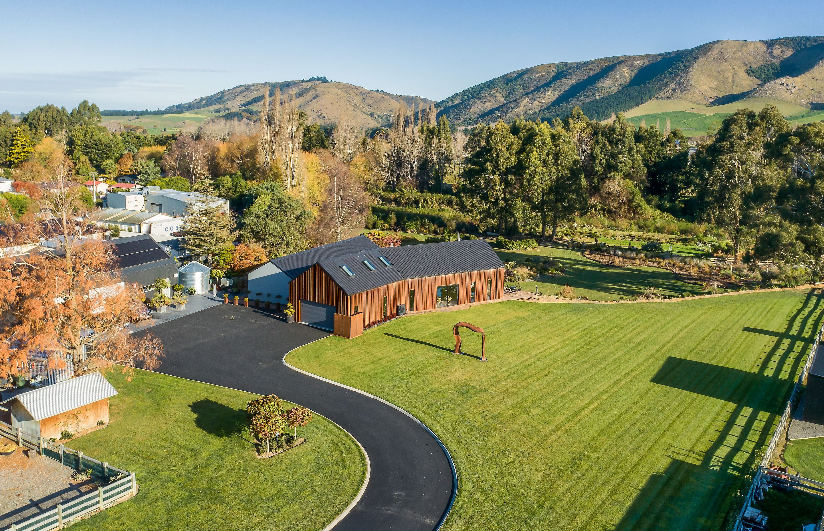 A corten sculpture was crafted to welcome guests at the front of the property.