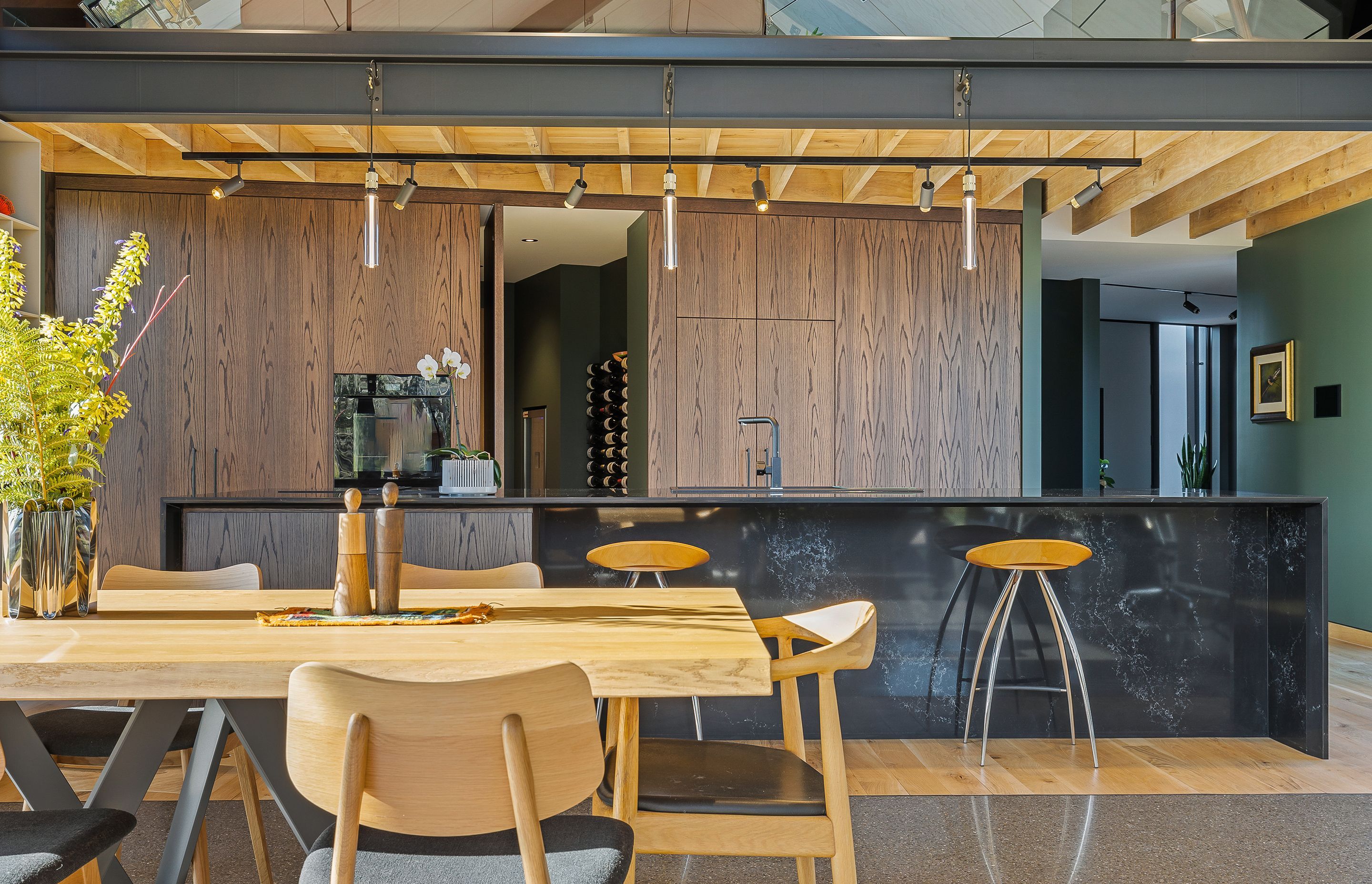 A hidden door in the kitchen cabinetry enters into the scullery and wine room.