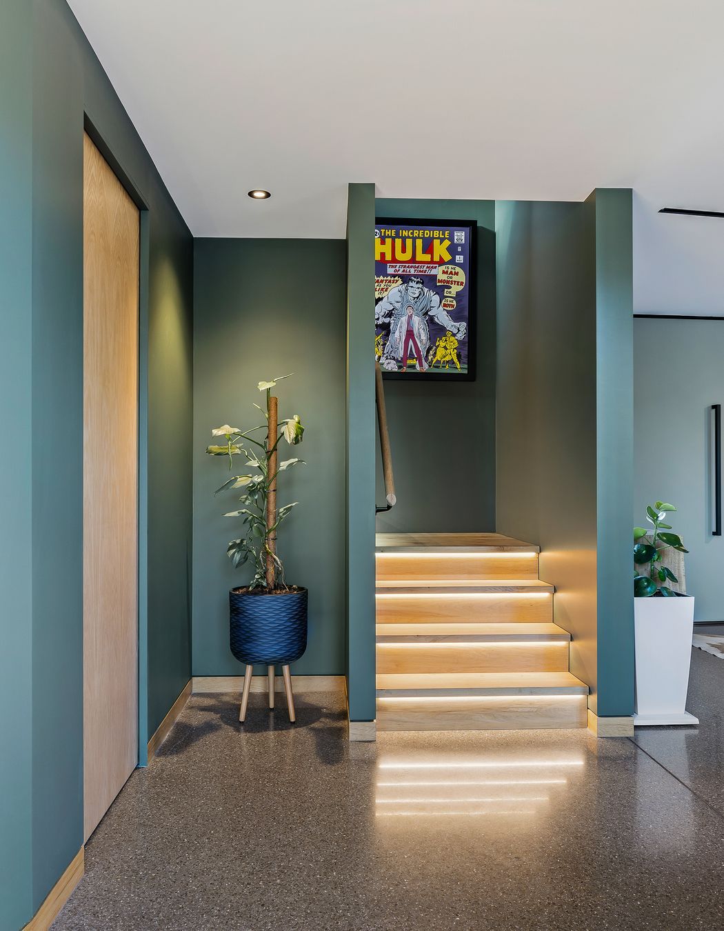 Lighting accents the oak stair treads.