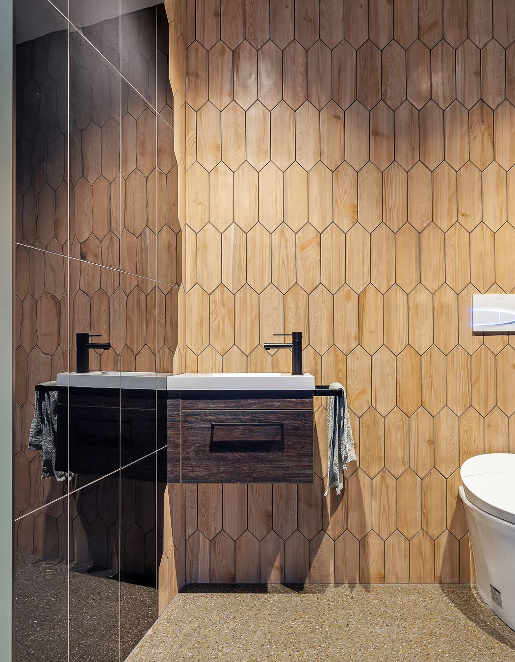 A powder room for guests is found underneath the staircase to the mezzanine level.