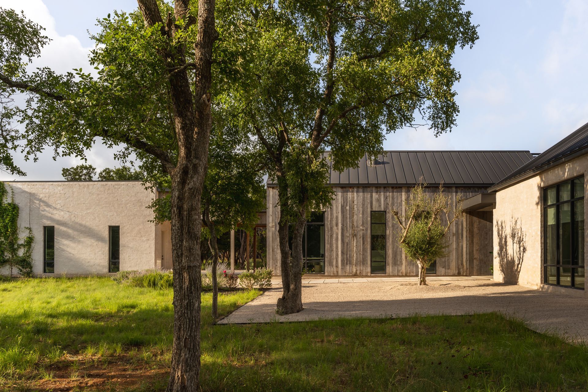 Mid-century-modern-rustic-custom-home-exterior-angle-v3.jpg
