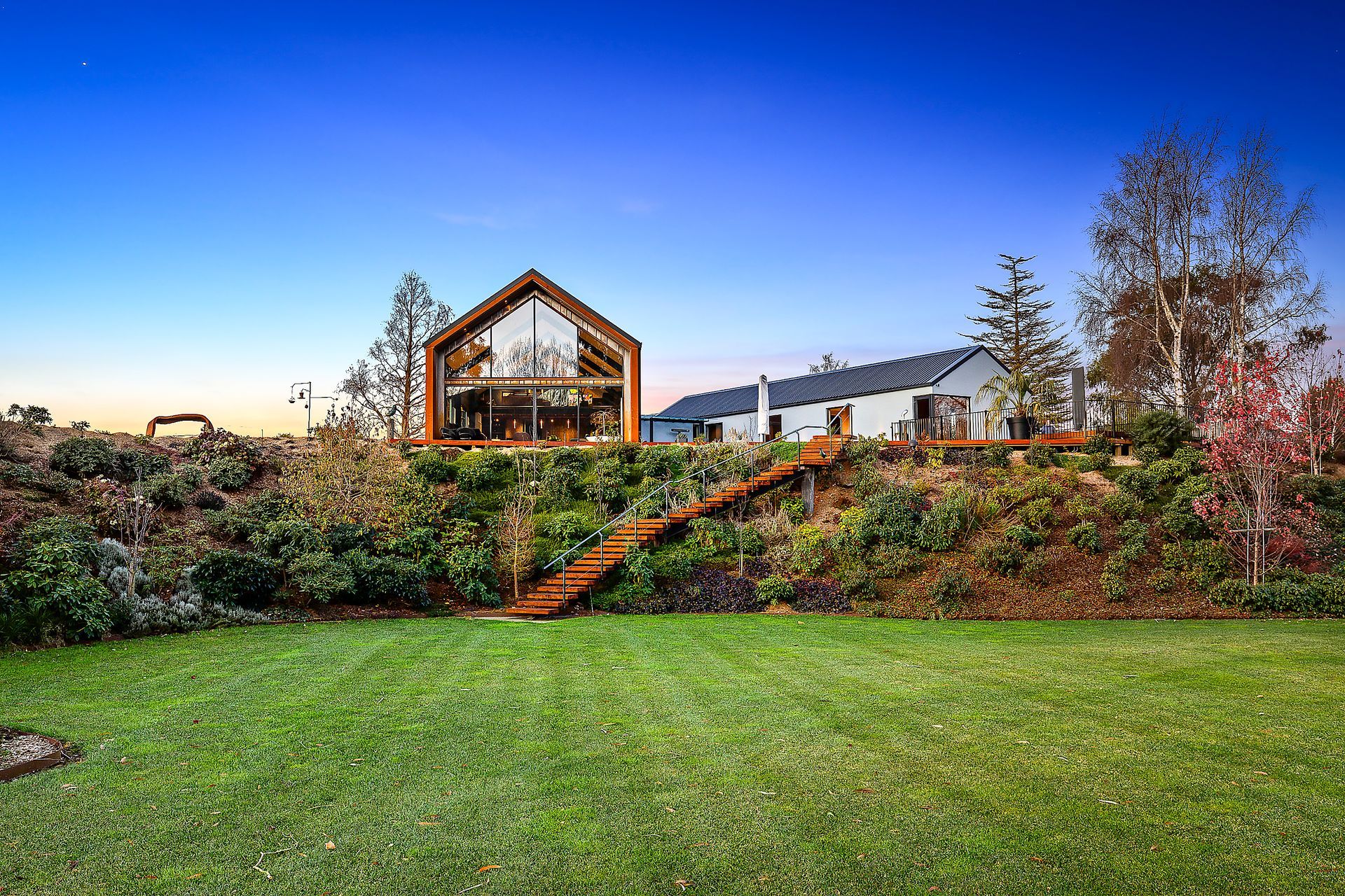 The home overlooks the established gardens on the property.