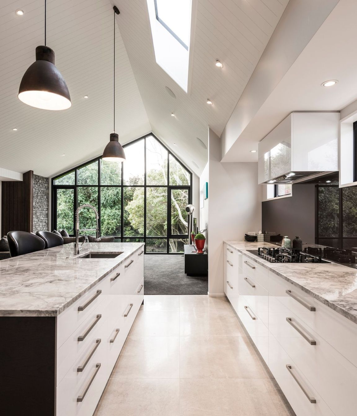 Due to height restrictions, an asymmetrical pitched roof means the apex is as high as possible to create as sense of grandeur.