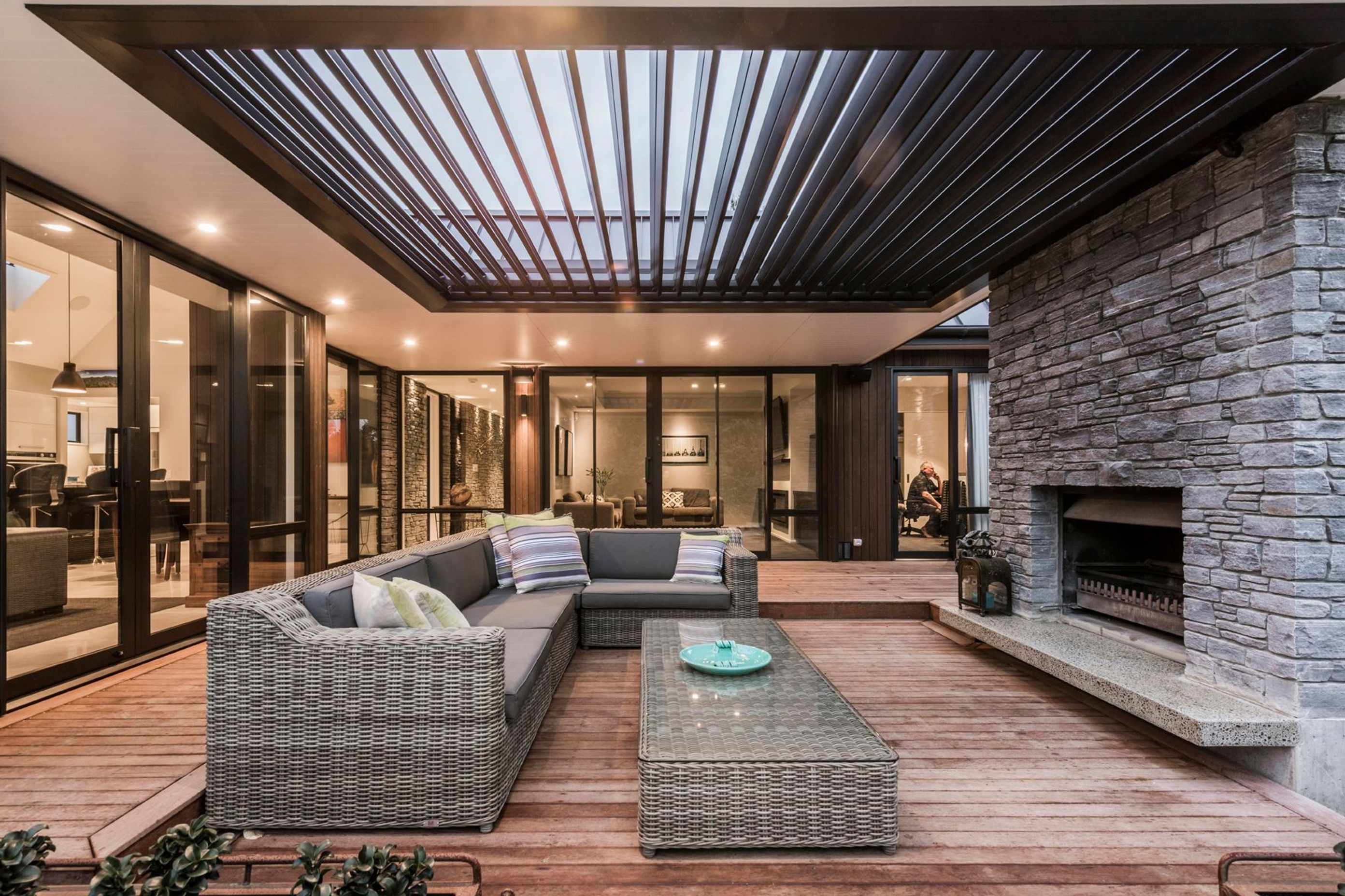Behind the covered outdoor area, the lounge/media room provides a third living space, so that the family can spread out.