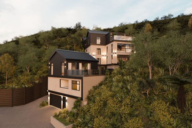 A dusk architectural rendering of a contemporary multi-level hillside residence nestled among dense native vegetation. The house features dark metal pitched roofs, charcoal cladding, pale masonry walls, large glazed openings, balconies, and an integrated double garage accessed from a paved driveway. A second connected or adjacent volume rises behind the front dwelling on the sloping site.