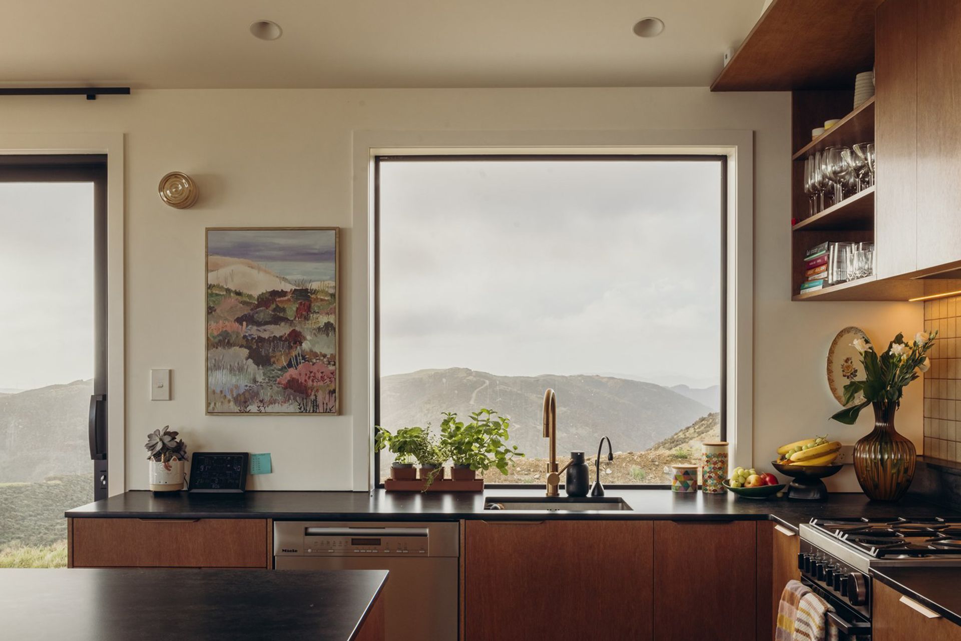 A central aim for this home was to create a sense of familiarity — a lived-in feel where everything feels considered and effortlessly placed. At the core is the kitchen and lounge: a welcoming, comfortable hub designed for both connection and quiet retreat.