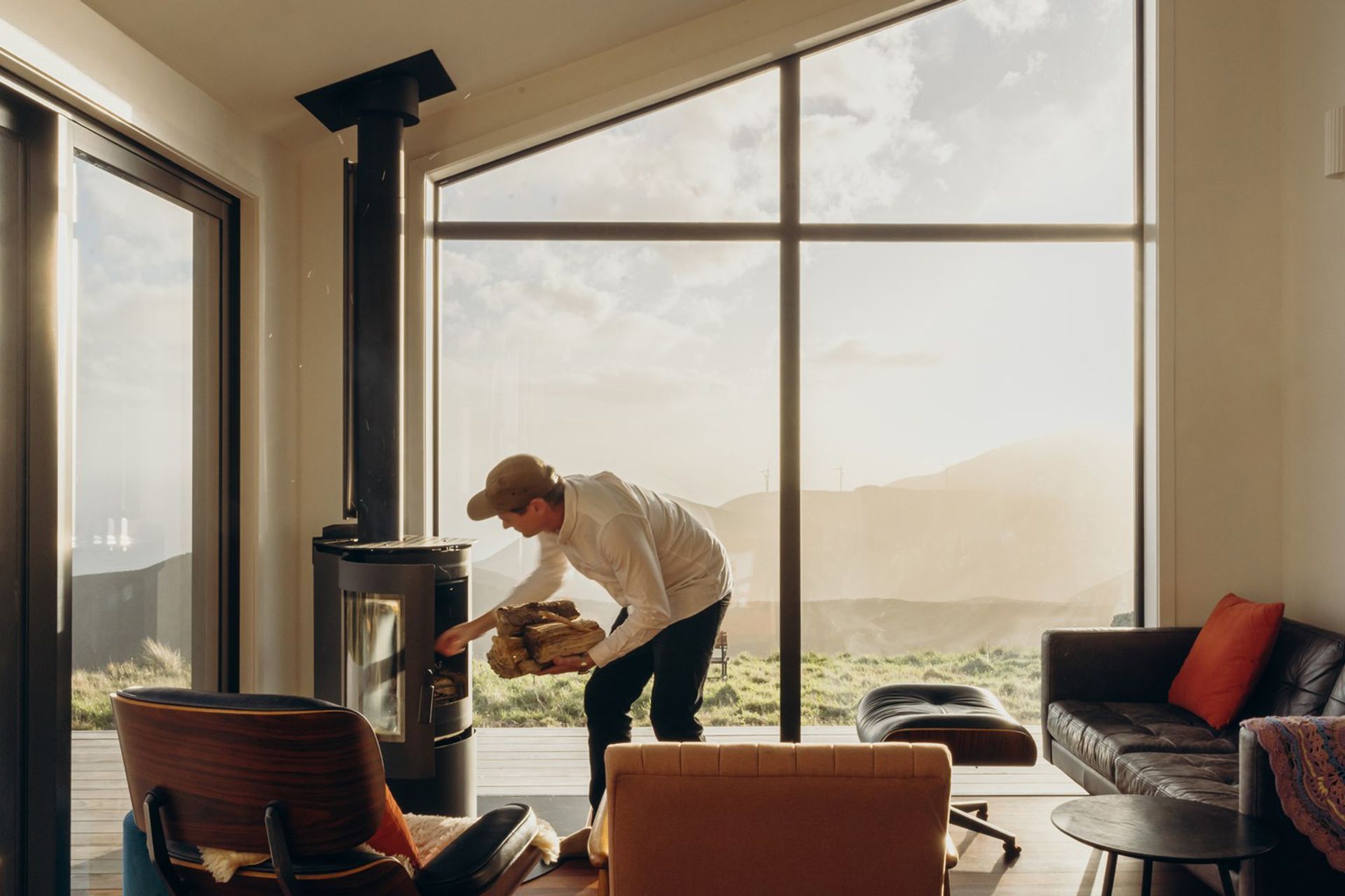 Framed by expansive windows overlooking the Cook Strait, this space is anchored by a roaring fire and ever-changing coastal views. Whether watching ferries glide past or weather sweep in from the south, this room offers a sense of calm and rhythm — a dynamic space that feels grounded, inviting, and deeply connected to its surroundings.