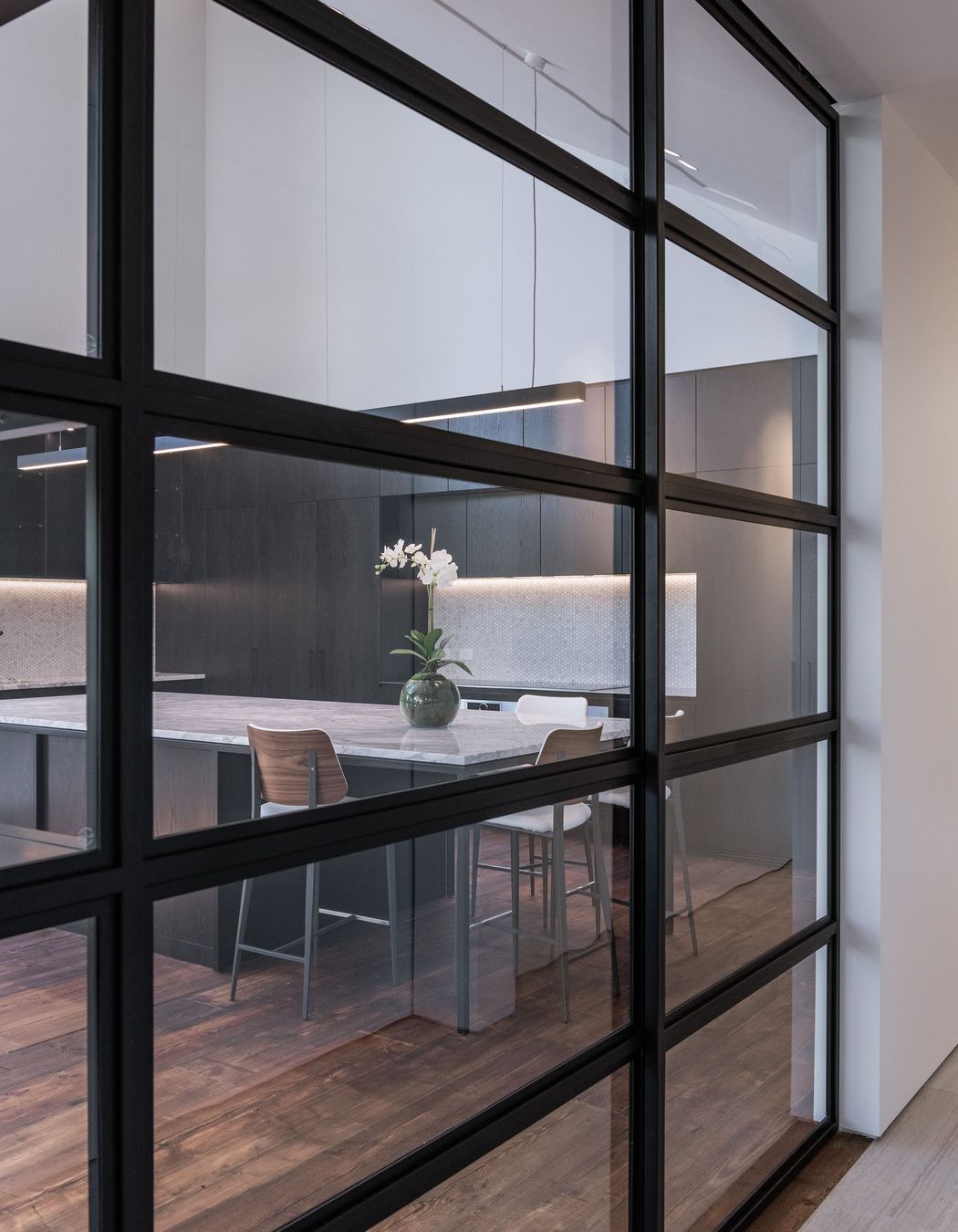 Parkdale-Dormer-House-Kitchen-Through-Steel-Doors-Stephen-Goodenough.jpg