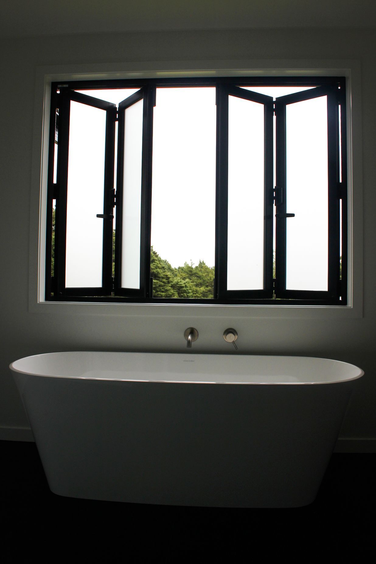 Bi-Folding joinery to make the most of this luxurious freestanding bath in the family bathroom