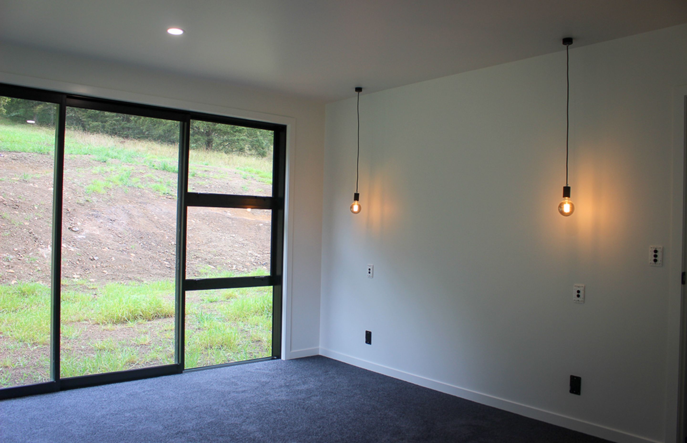 The bedrooms in the build have been kept contemporary and simple.  Full sliding joinery, beautiful wool carpeting and lots of storage for this busy family