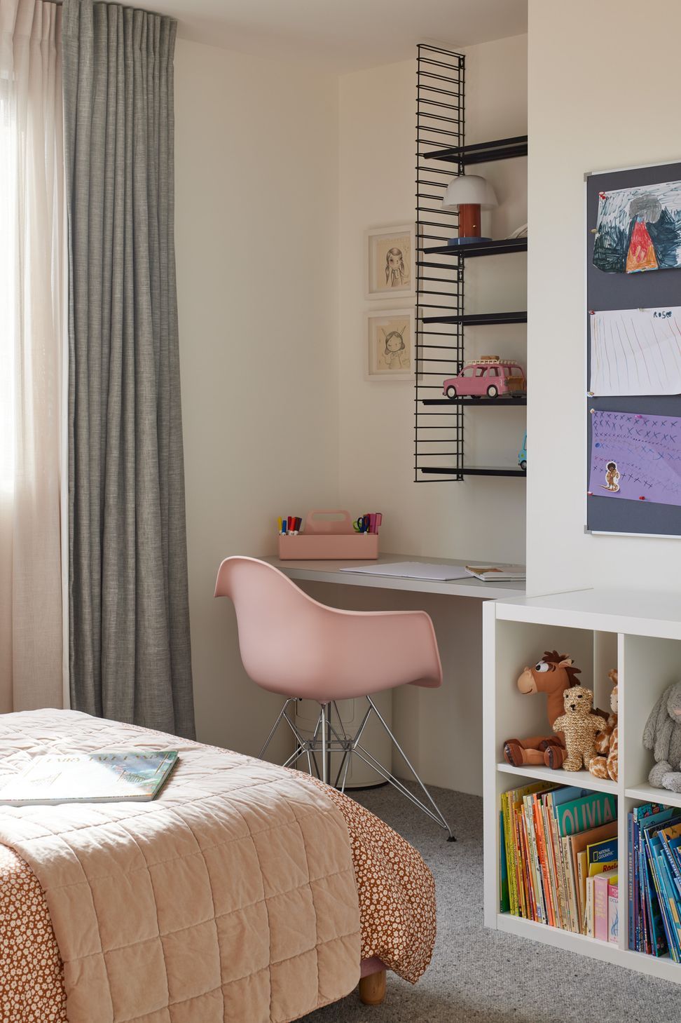 Designed to adapt as children grow, this bedroom pairs a built in study desk with generous overhead shelving to create a practical space for learning, creativity and everyday organisation. The simple, timeless detailing ensures the room can evolve with its young occupant over the years.