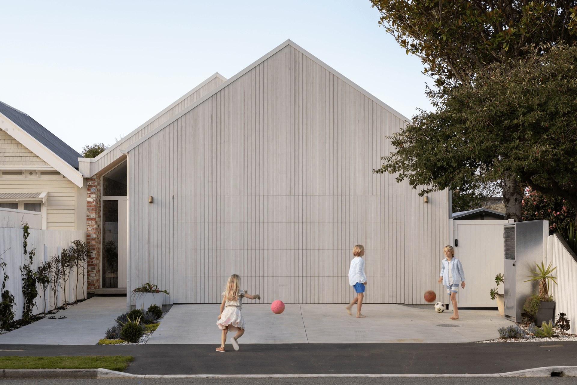 Simple gable form with the glass front door hinting at whats behind