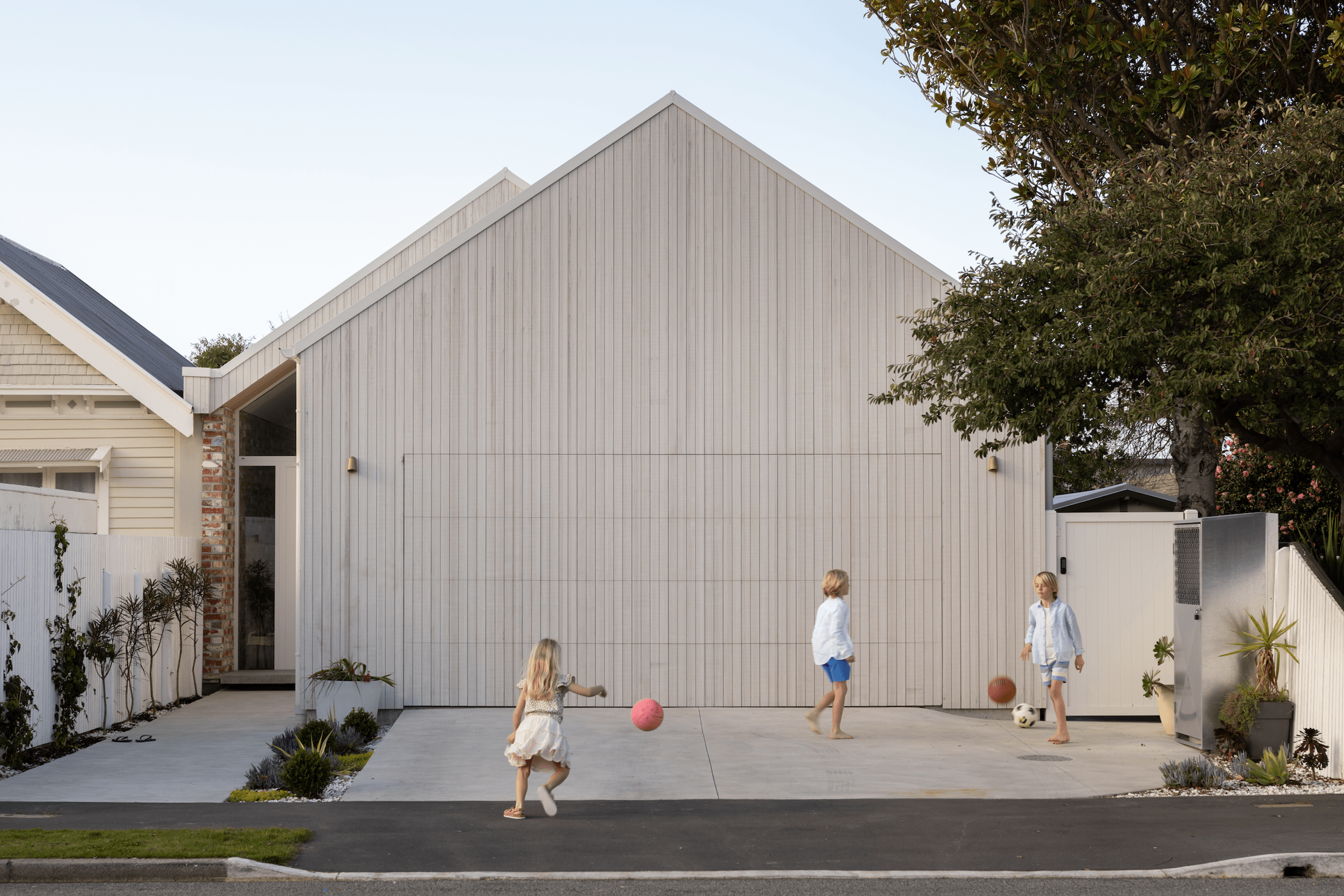 Simple gable form with the glass front door hinting at whats behind