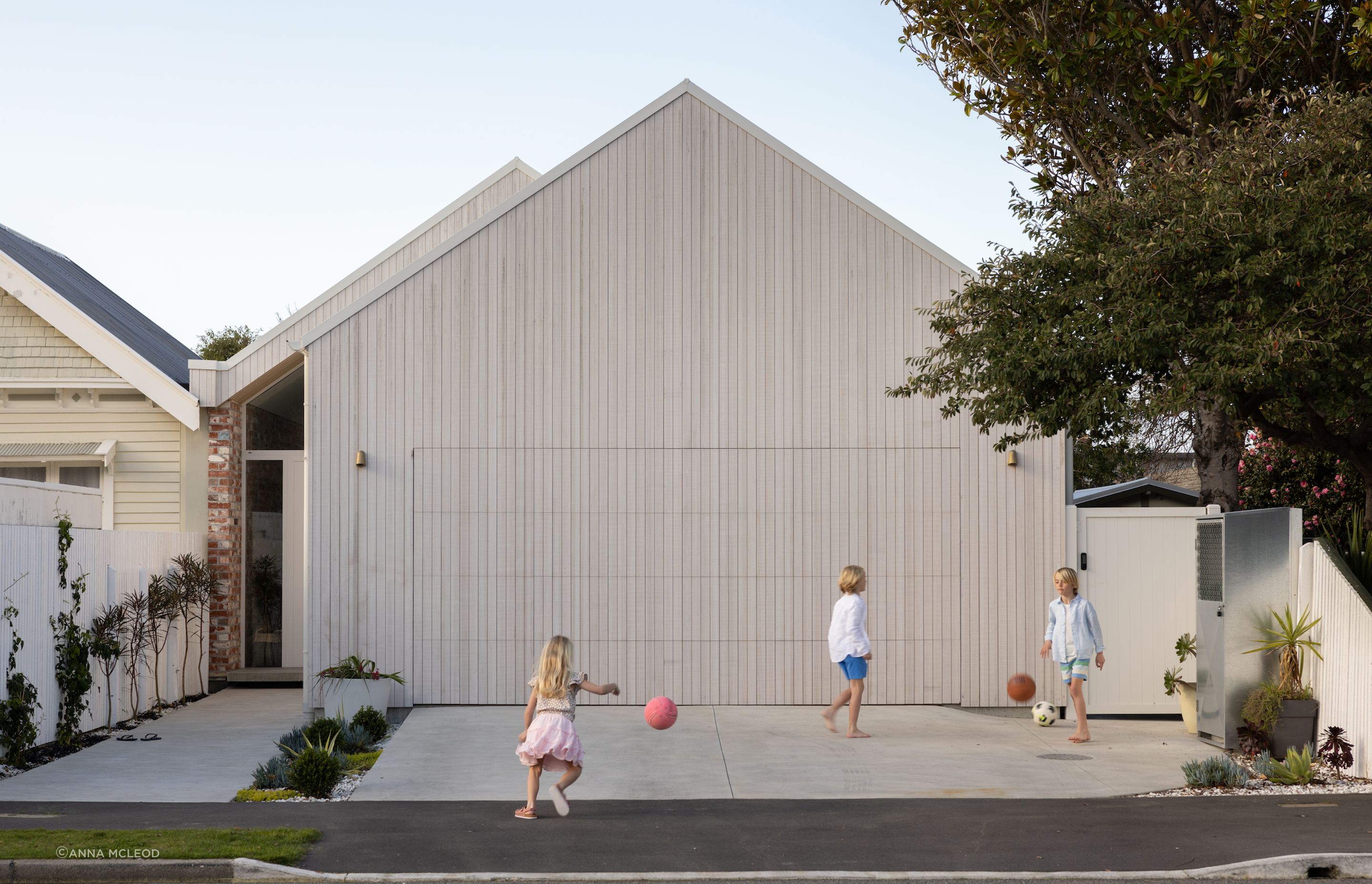 Simple gable form with the glass front door hinting at whats behind