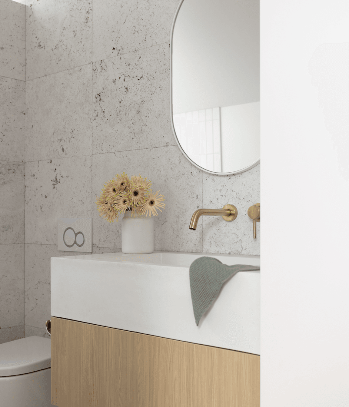 Silver travertine tiles from Artedomus and RAW Concrete basin