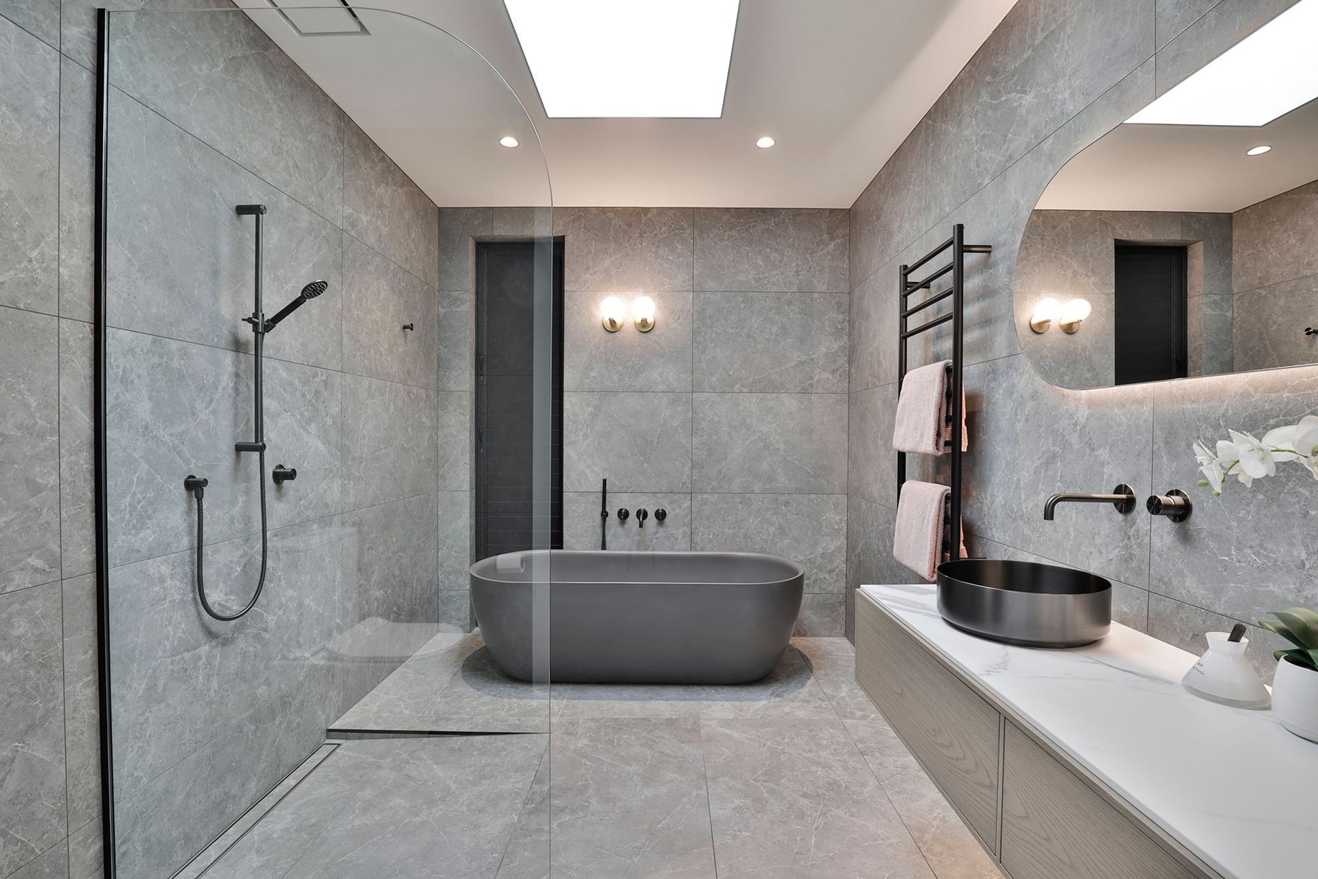 Design by Cube Dentro. Tile: Trilogy Sandy Grey Soft 600x1200mm. Stocked in 595x595mm.