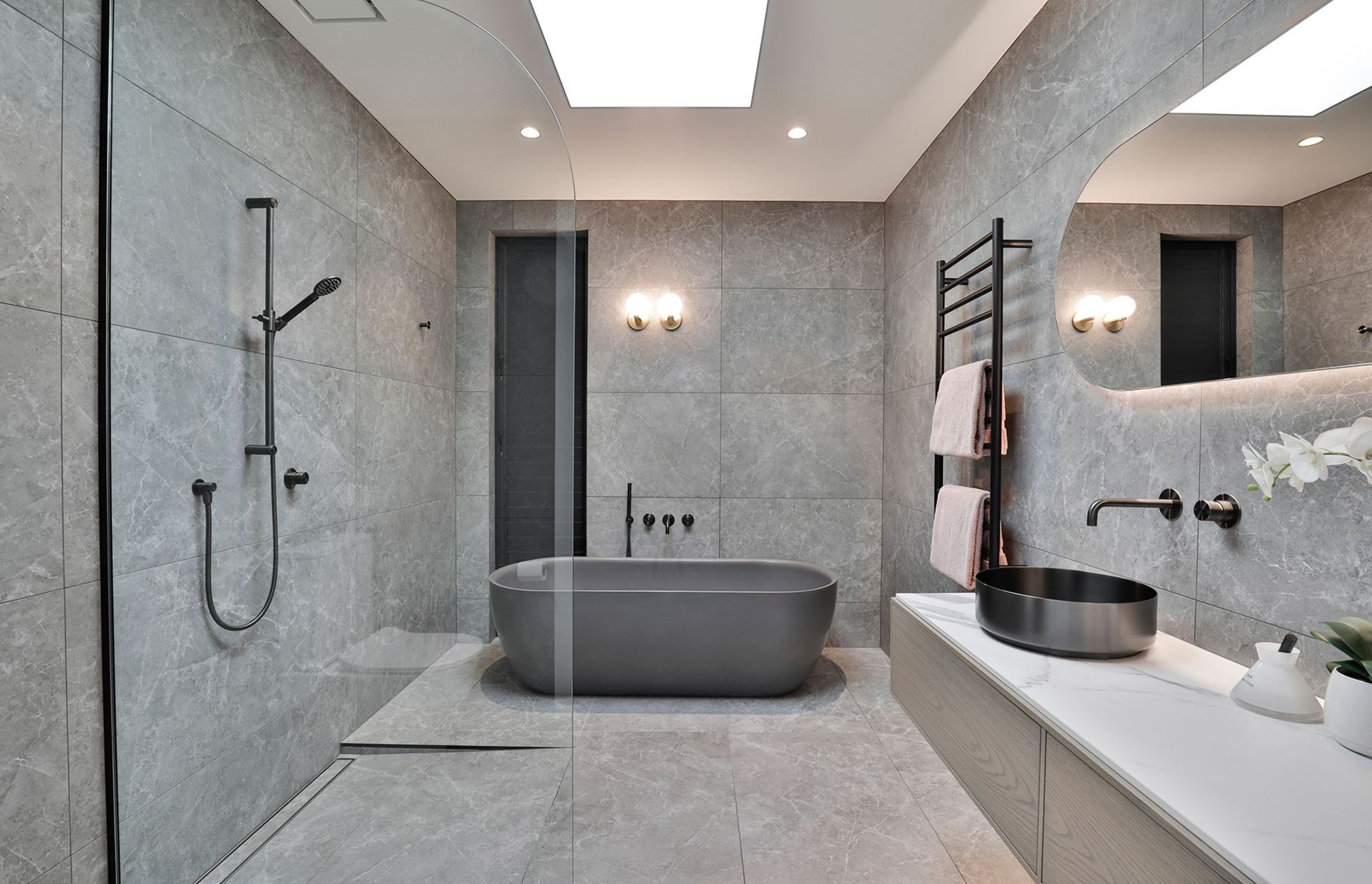 Design by Cube Dentro. Tile: Trilogy Sandy Grey Soft 600x1200mm. Stocked in 595x595mm.