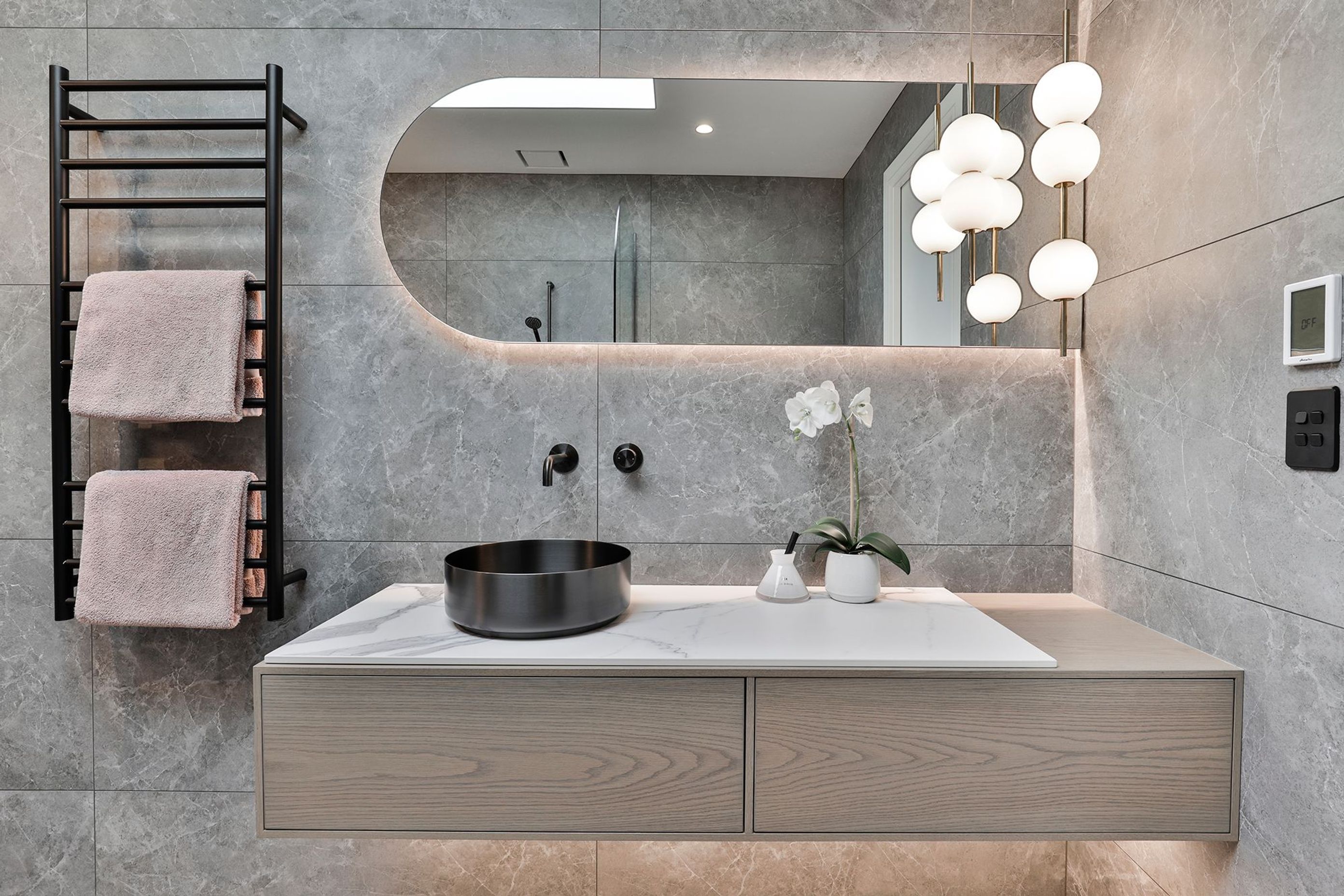 Design by Cube Dentro. Tile: Trilogy Sandy Grey Soft 600x1200mm. Stocked in 595x595mm