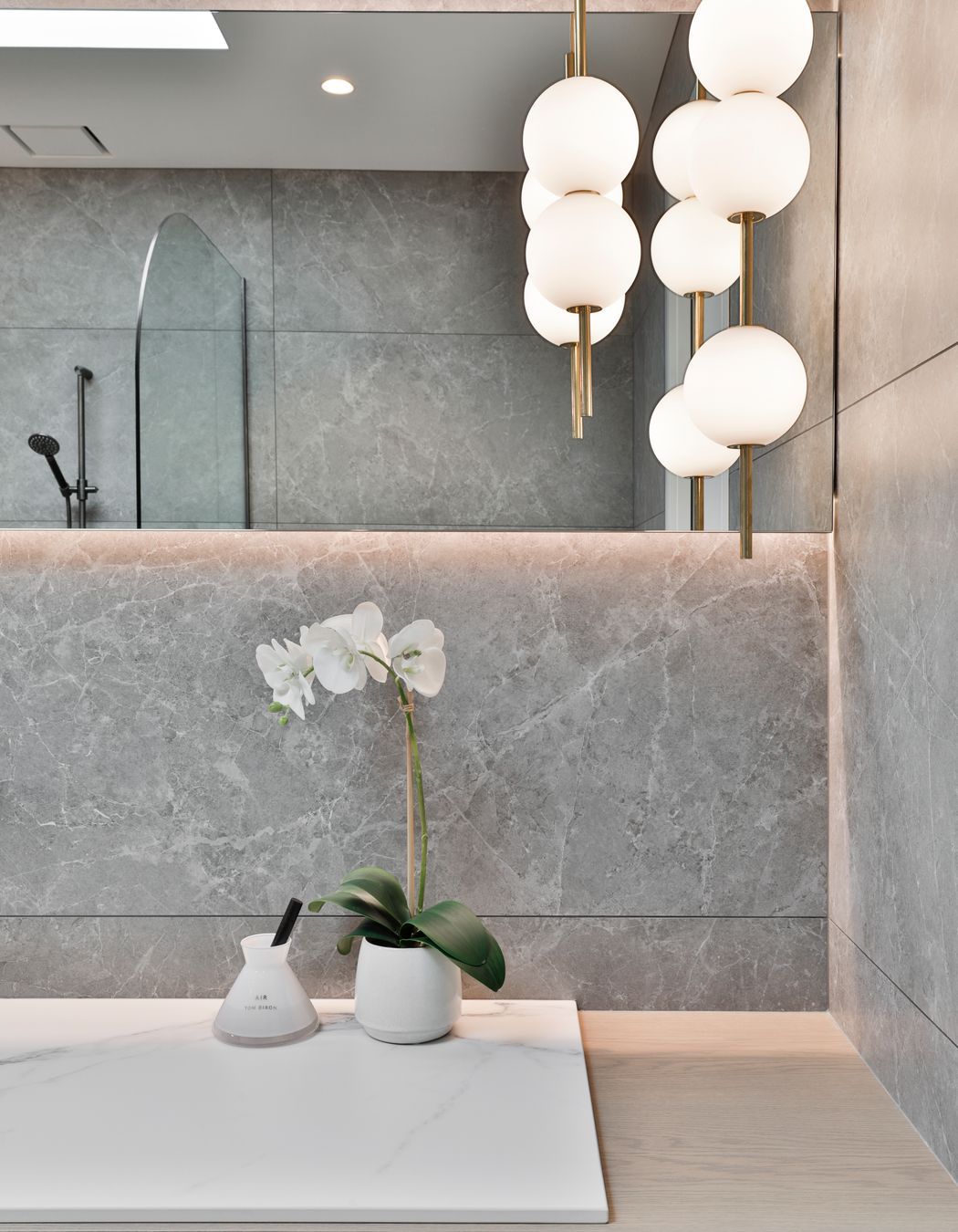 Design by Cube Dentro. Tile: Trilogy Sandy Grey Soft 600x1200mm. Stocked in 595x595mm