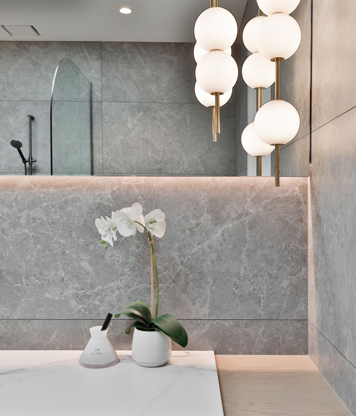 Design by Cube Dentro. Tile: Trilogy Sandy Grey Soft 600x1200mm. Stocked in 595x595mm