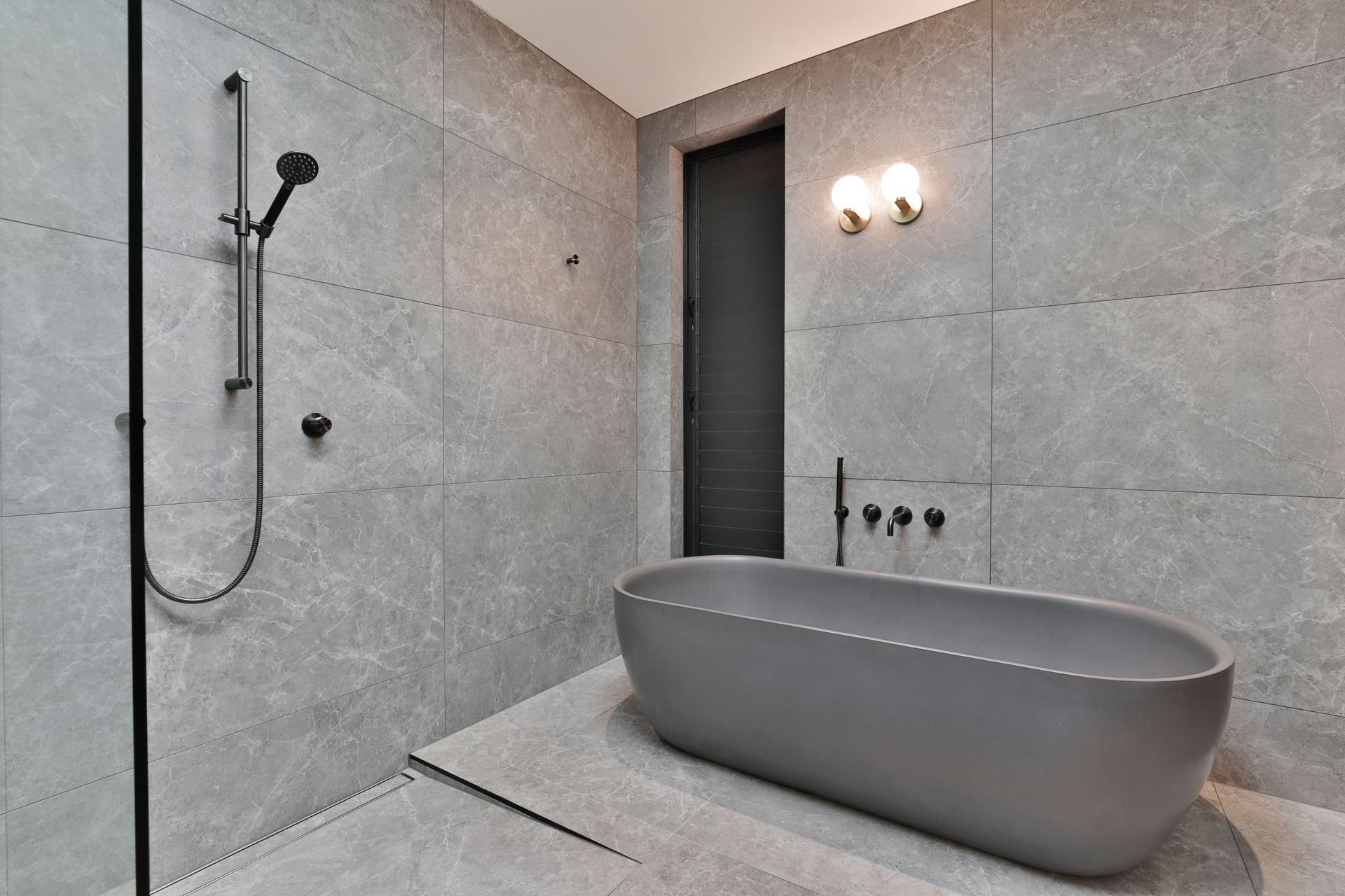 Design by Cube Dentro. Tile: Trilogy Sandy Grey Soft 600x1200mm. Stocked in 595x595mm