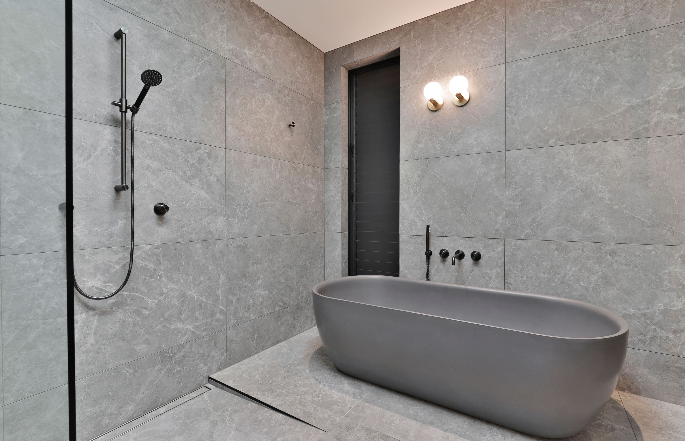 Design by Cube Dentro. Tile: Trilogy Sandy Grey Soft 600x1200mm. Stocked in 595x595mm