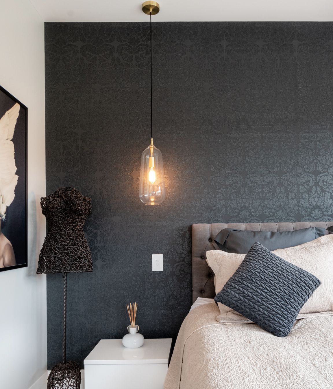 Carefully chosen wallpaper from Tobin is an artful addition to this bedroom.