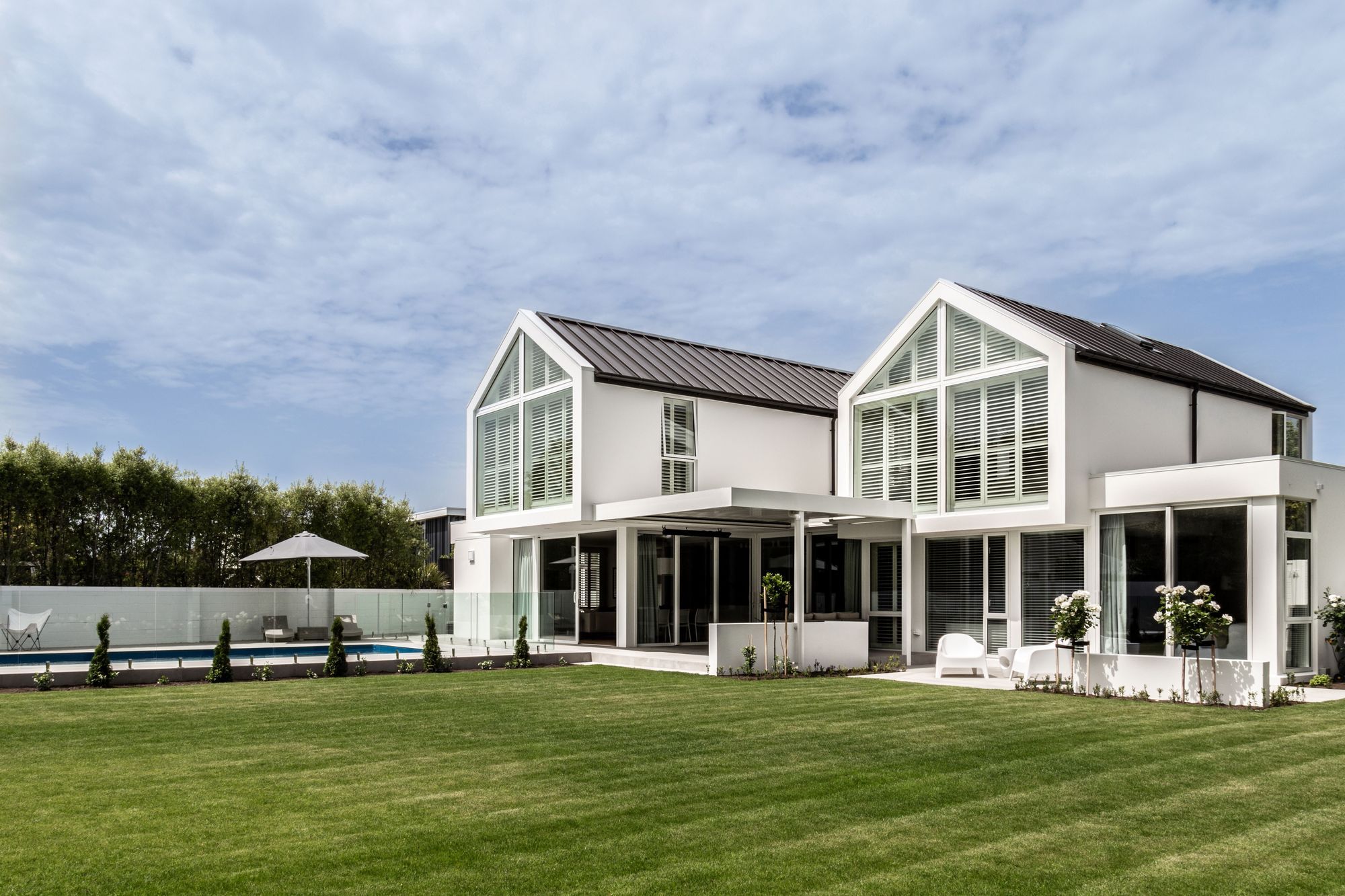 The back end of the gables are glazed, to let light in through the north-facing backyard.
