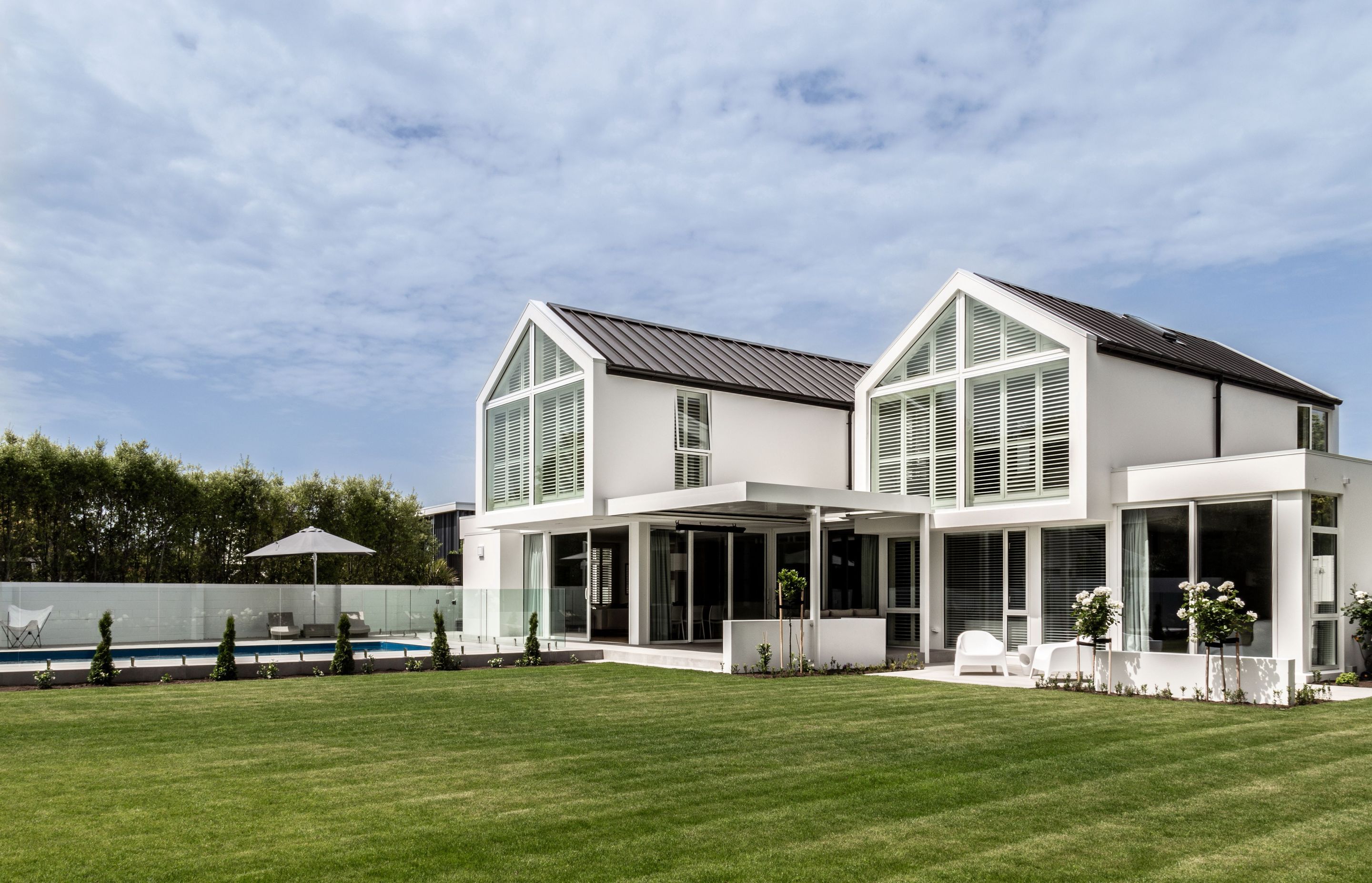 The back end of the gables are glazed, to let light in through the north-facing backyard.