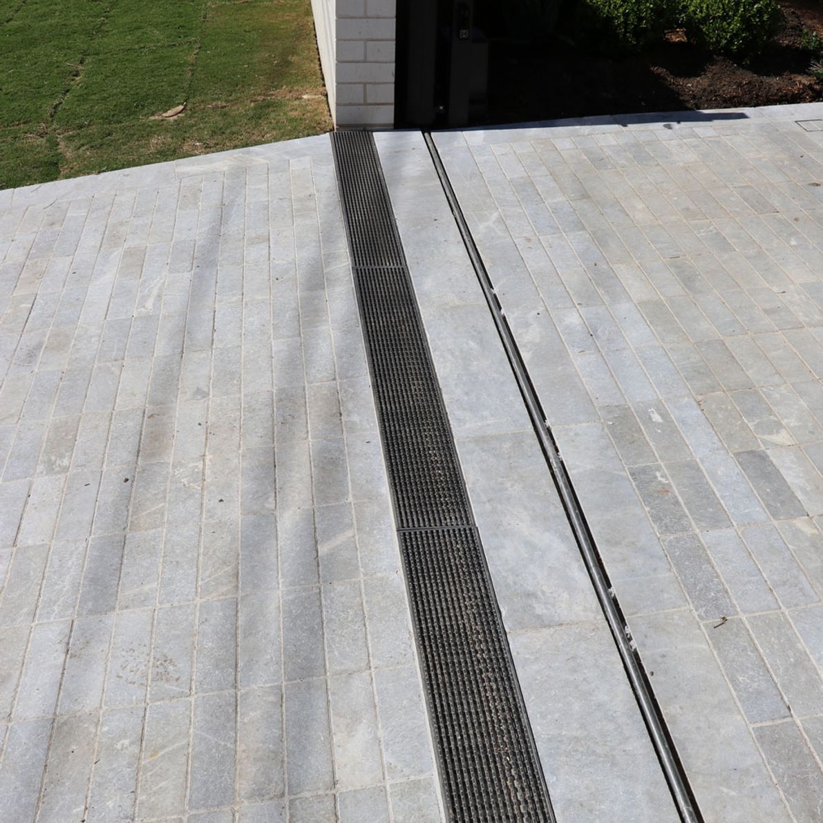 strip-drain-stainless-steel-heel-guard-on-driveway-at-sydney-home.jpg