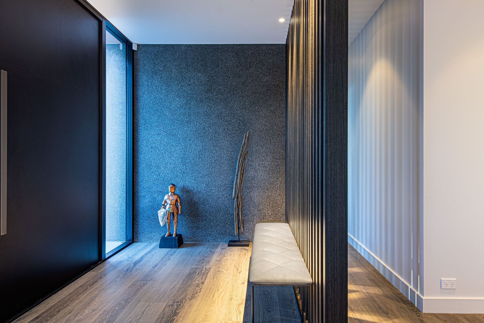 The concrete features a diamond-brushed stone finish, which also was used inside the home as well as a response to minimising the number of walls.