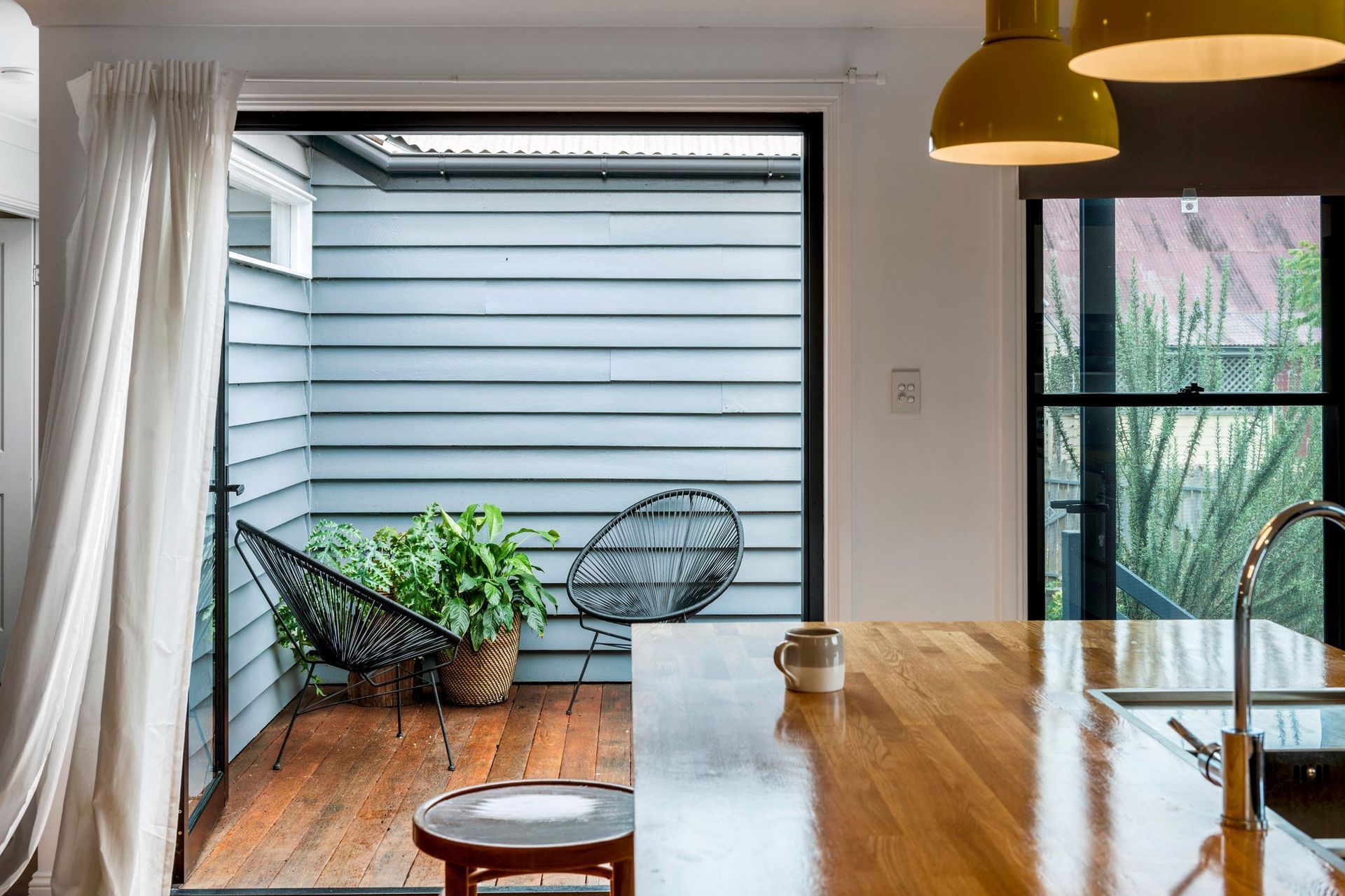 An external deck links the original cottage and the new extension, and leads you out to the kitchen garden.