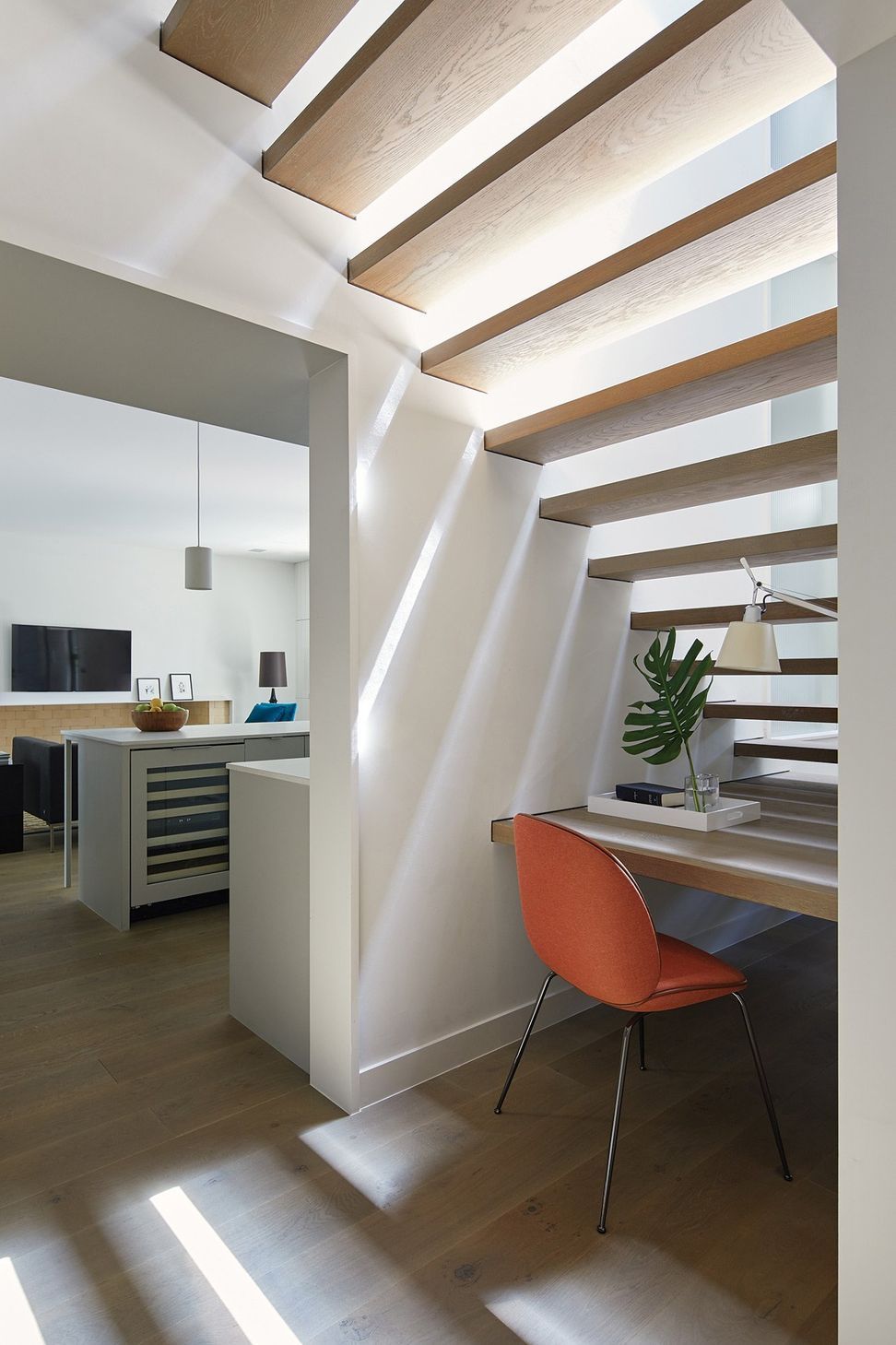 15ForestParkCuppettKilpatrickArchitectureandInteriorDesignaustin-tx-modern-office-nook-under-staircase-wooden-tread-desk.jpg