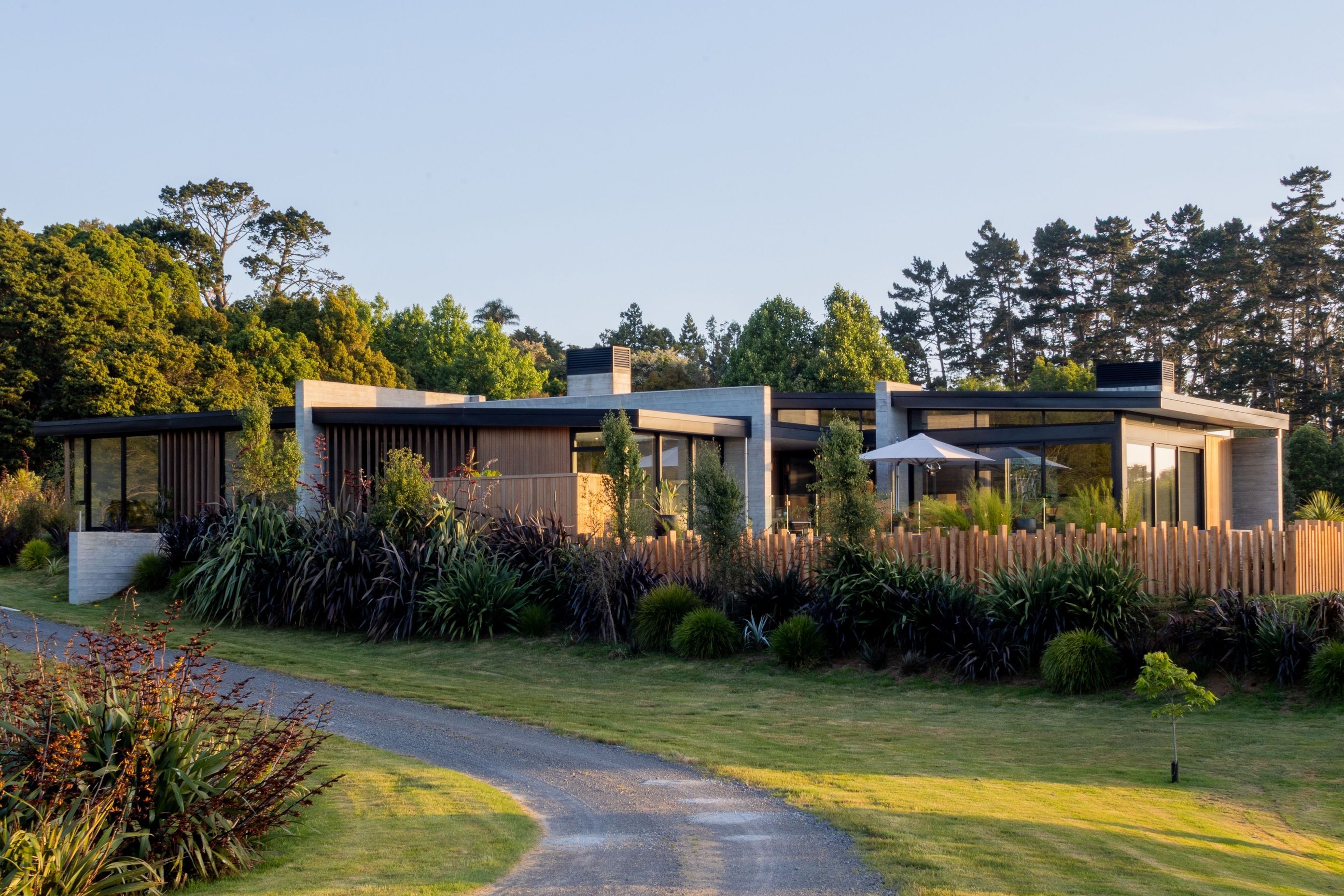 Strong elements of Insitu-concrete contrast with the warmth of Vertical Cedar Cladding in this home which sits within the landscape.