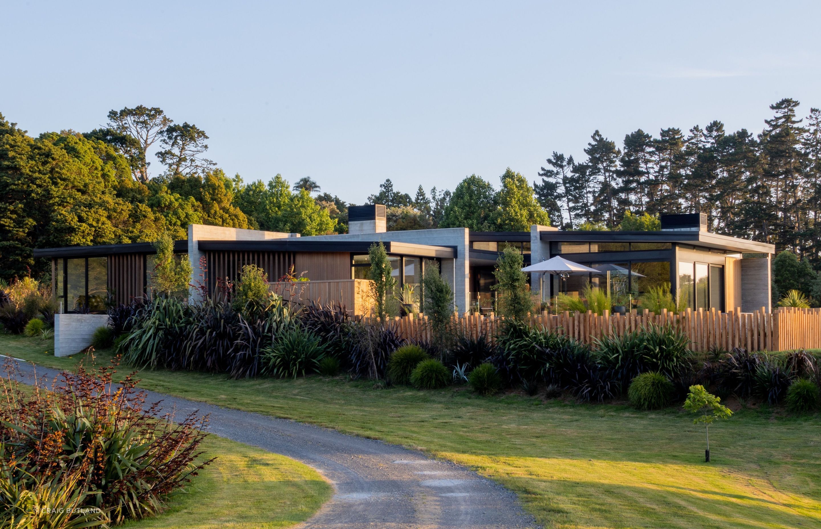 Strong elements of Insitu-concrete contrast with the warmth of Vertical Cedar Cladding in this home which sits within the landscape.