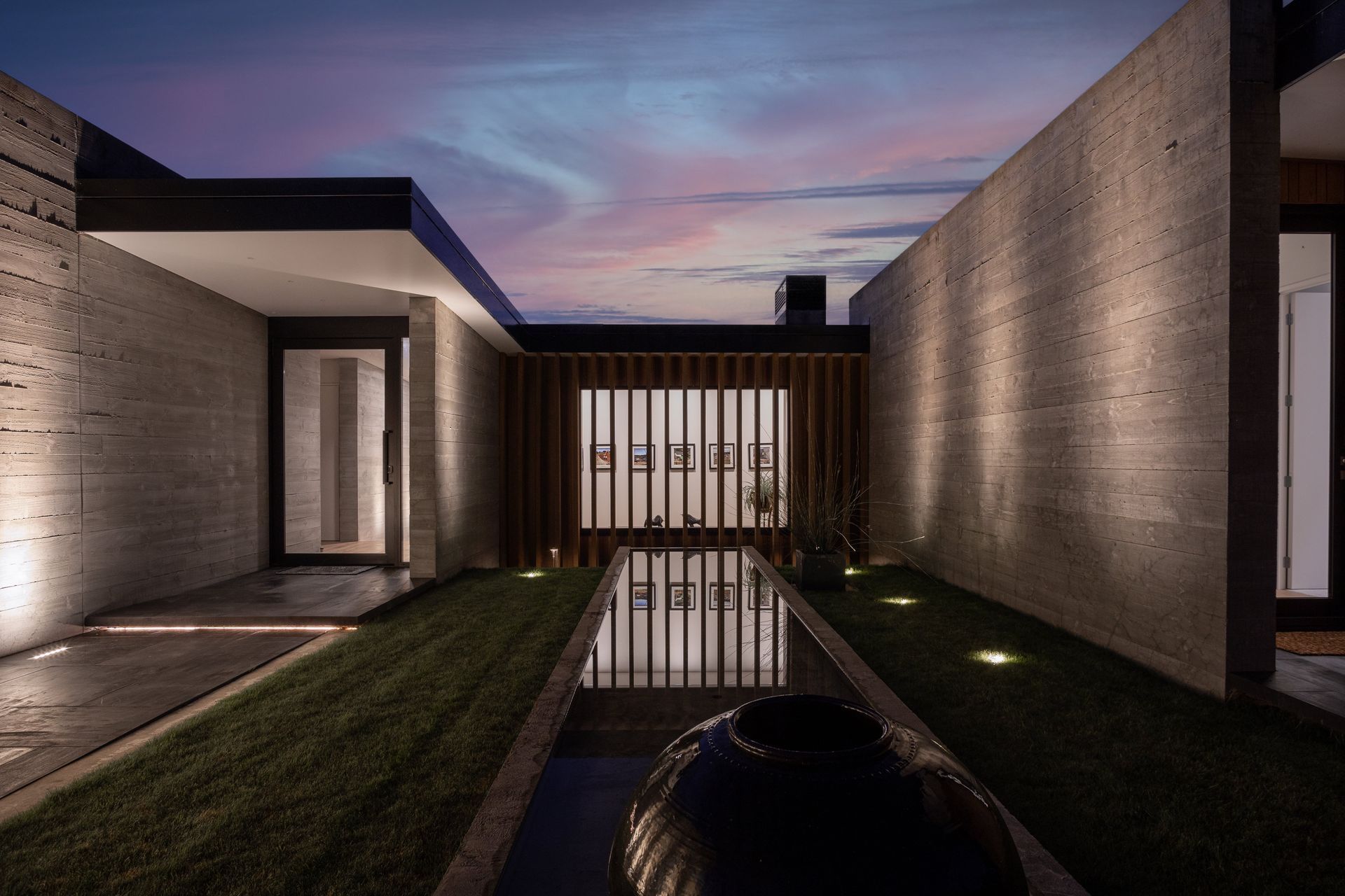 Moments of glazing are framed by the insitu-concrete walls through the entrance and breezeway.